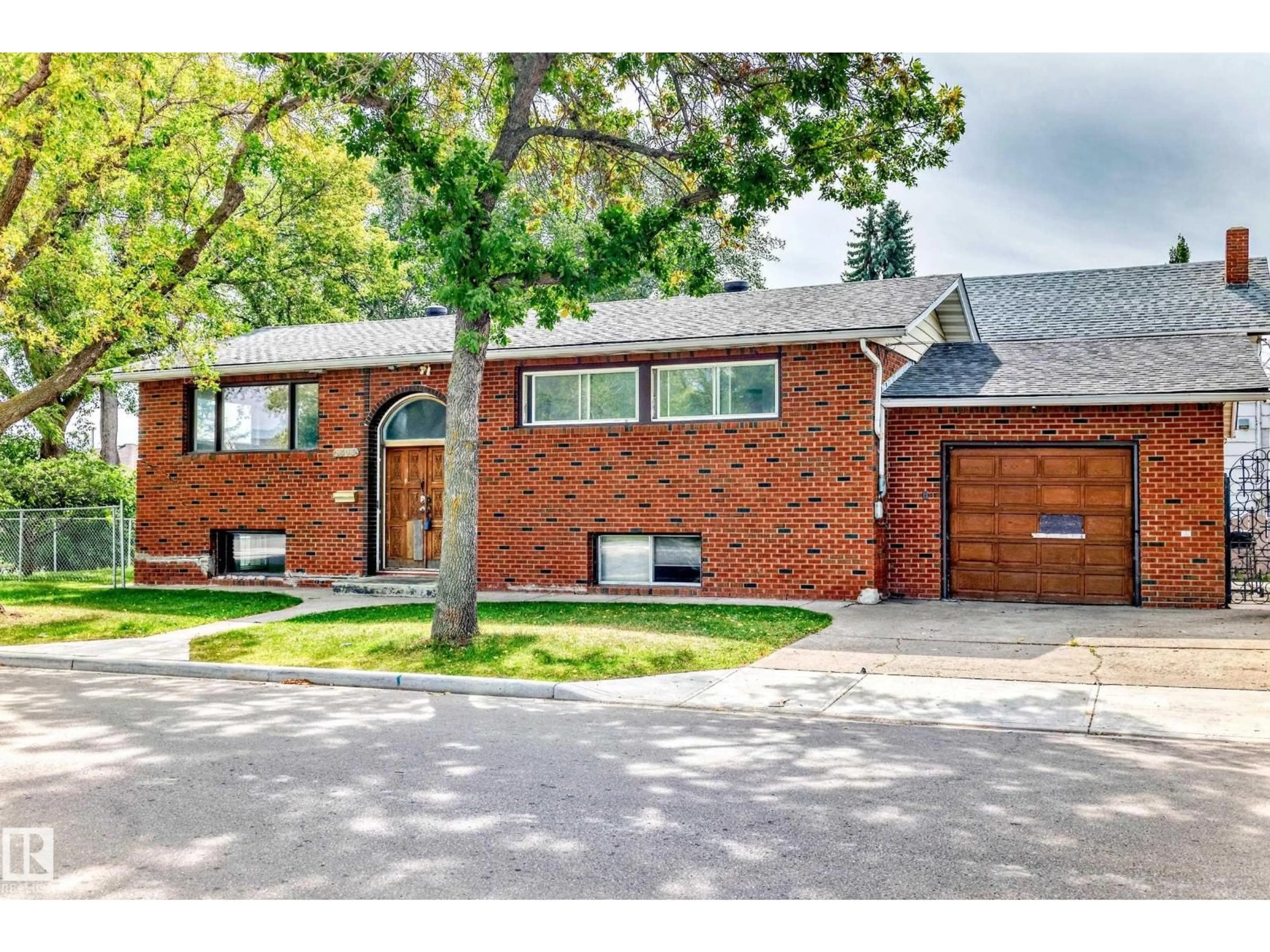 Home with brick exterior material, street for 8303 124 AV, Edmonton Alberta T5B1C3