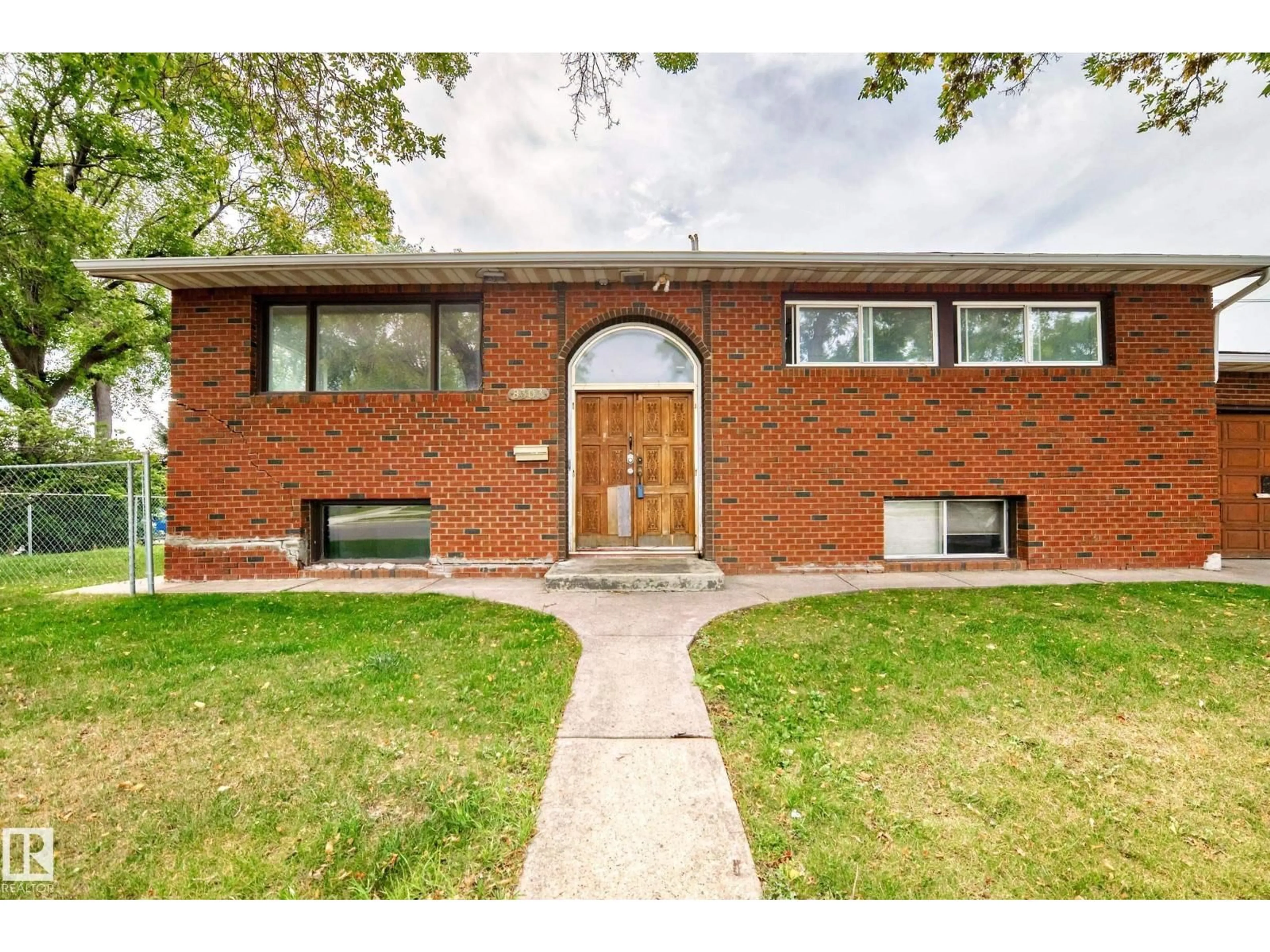 Home with brick exterior material, street for 8303 124 AV, Edmonton Alberta T5B1C3