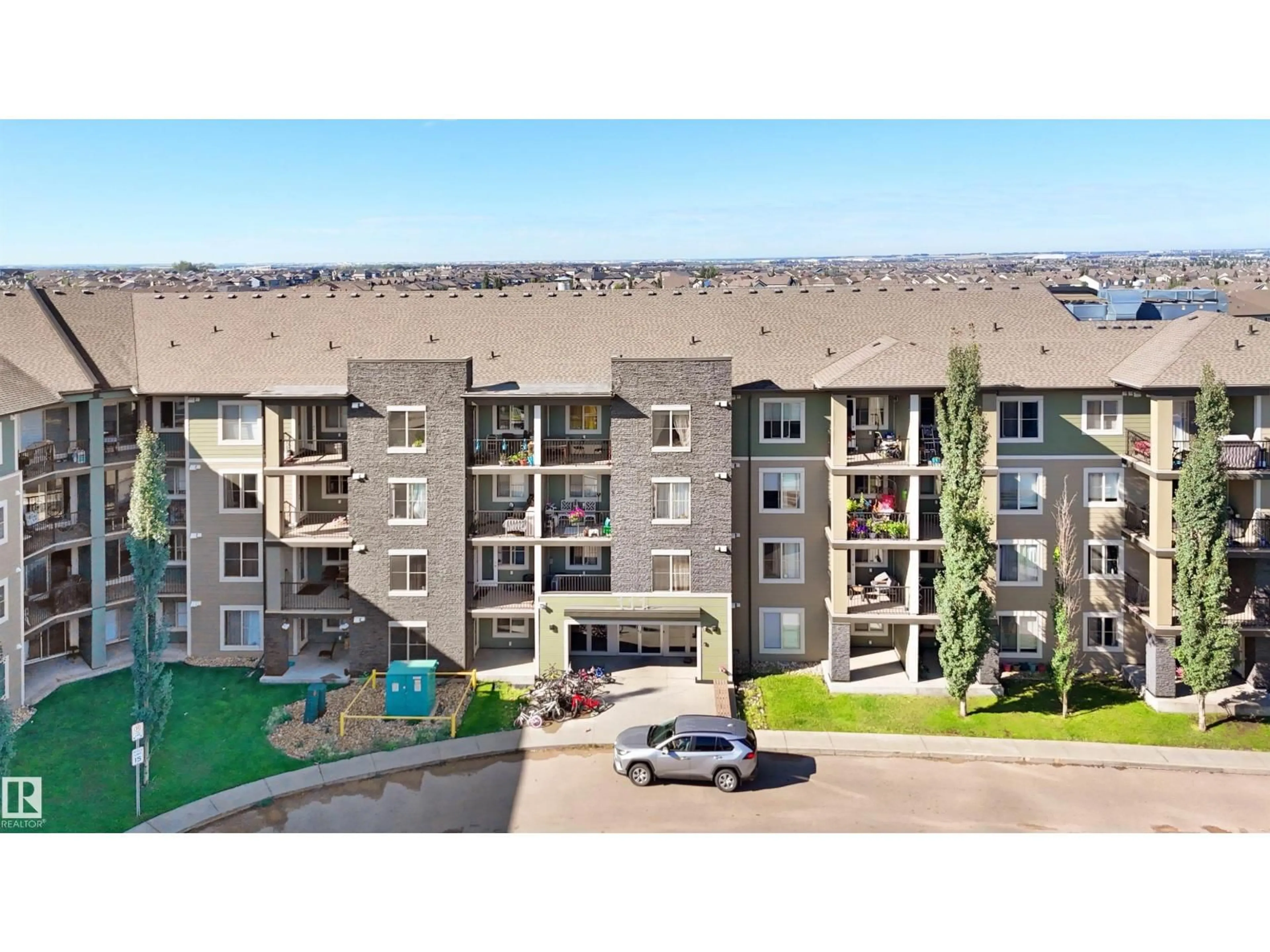 A pic from outside/outdoor area/front of a property/back of a property/a pic from drone, mountain view for #417 - 111 WATT CM, Edmonton Alberta T6X2C6