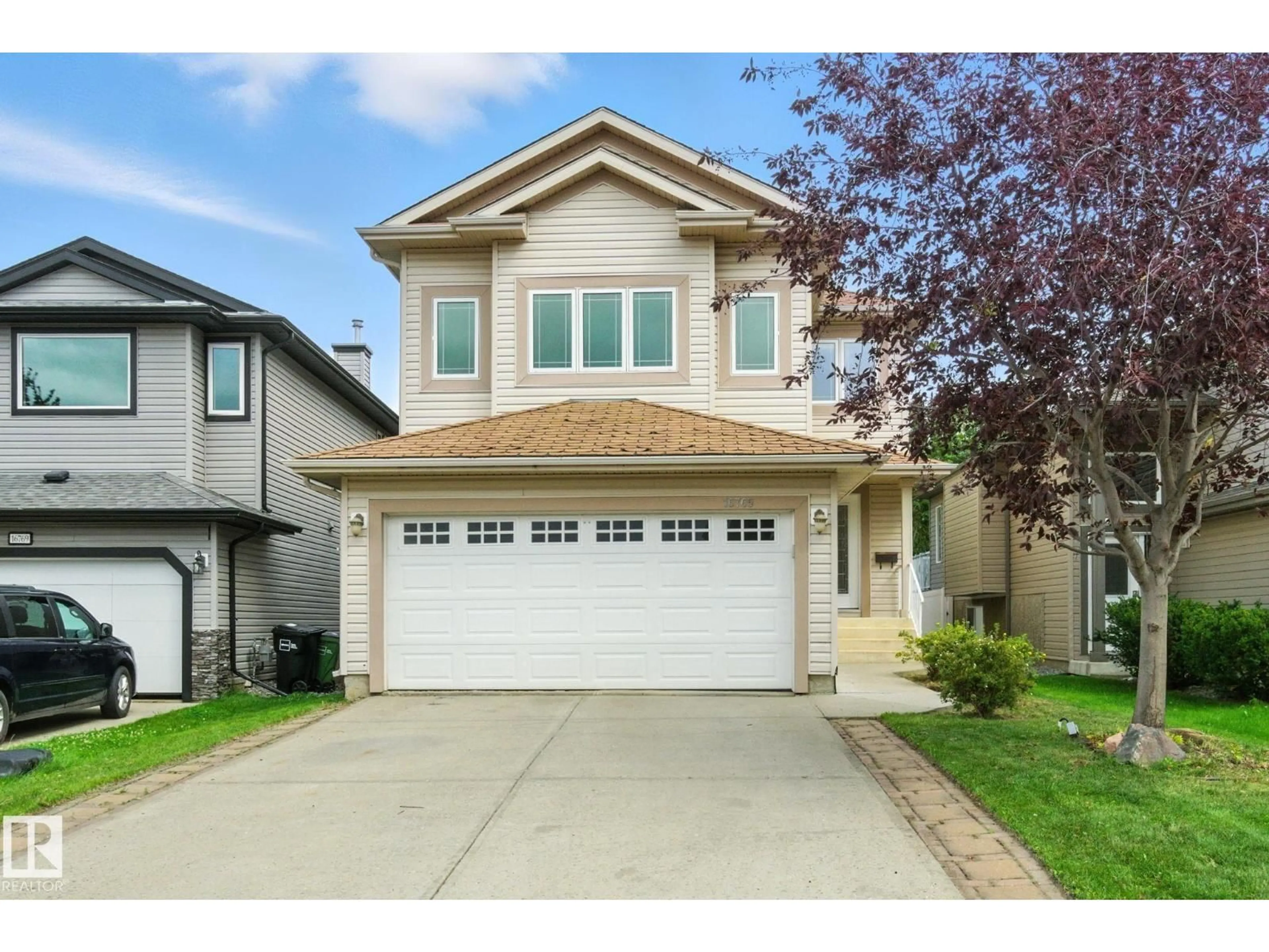 Home with vinyl exterior material, street for 16765 112A ST, Edmonton Alberta T5X6J6