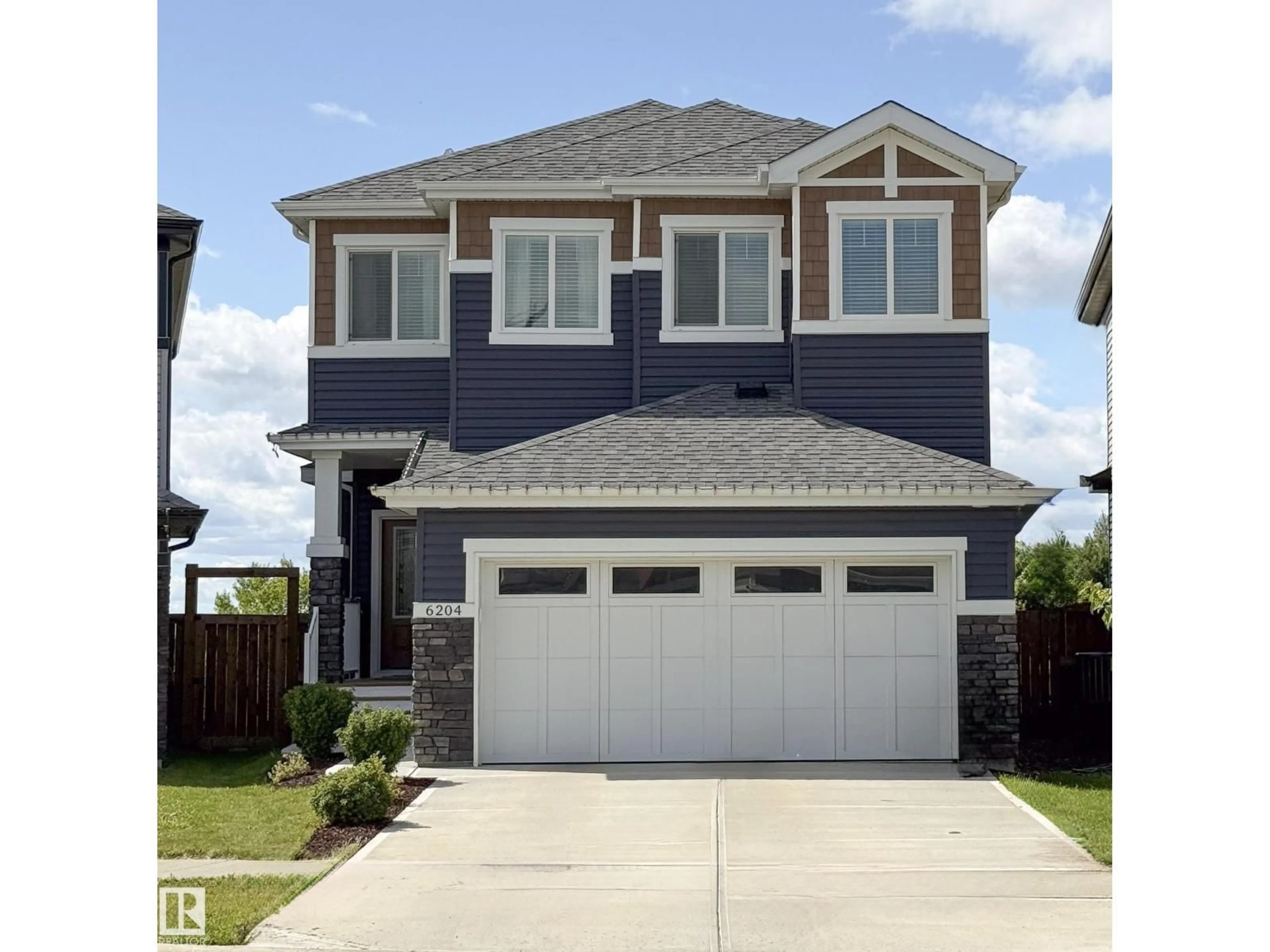 Home with vinyl exterior material, street for 6204 67 ST, Beaumont Alberta T4X2E3
