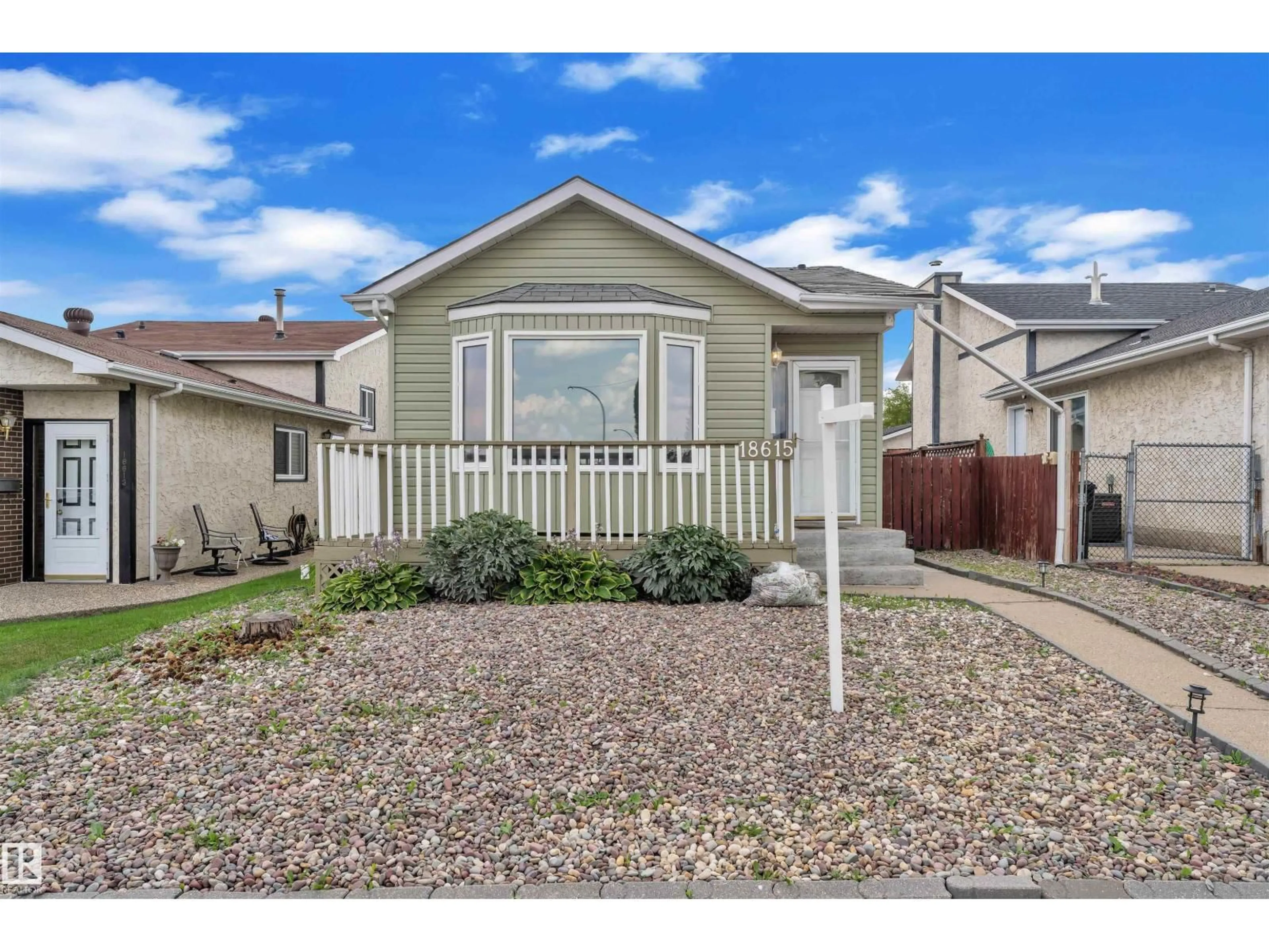 Home with vinyl exterior material, street for 18615 75 AV, Edmonton Alberta T5T5J9
