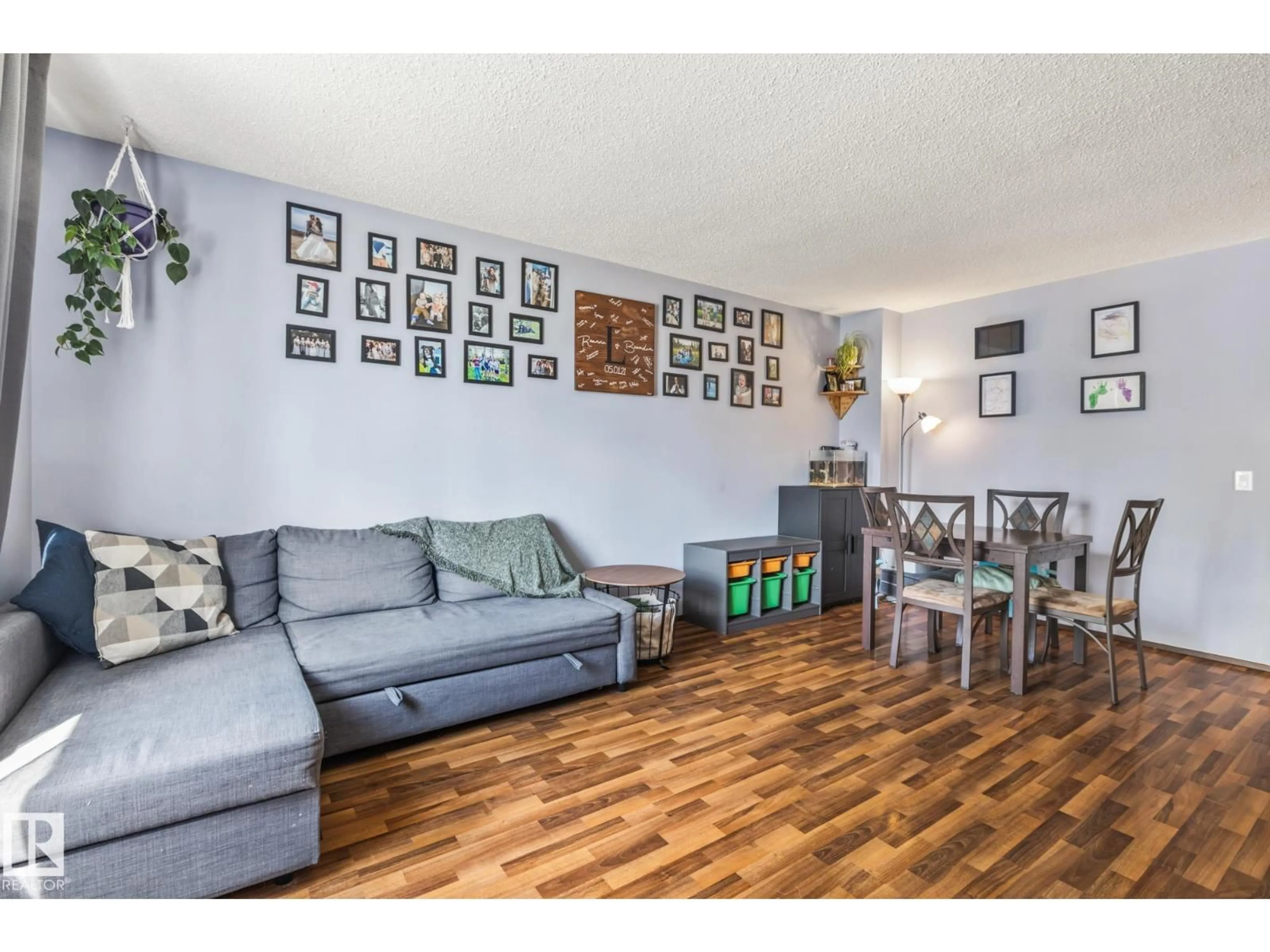Living room with furniture, wood/laminate floor for 3211 44A ST, Edmonton Alberta T6L4X1