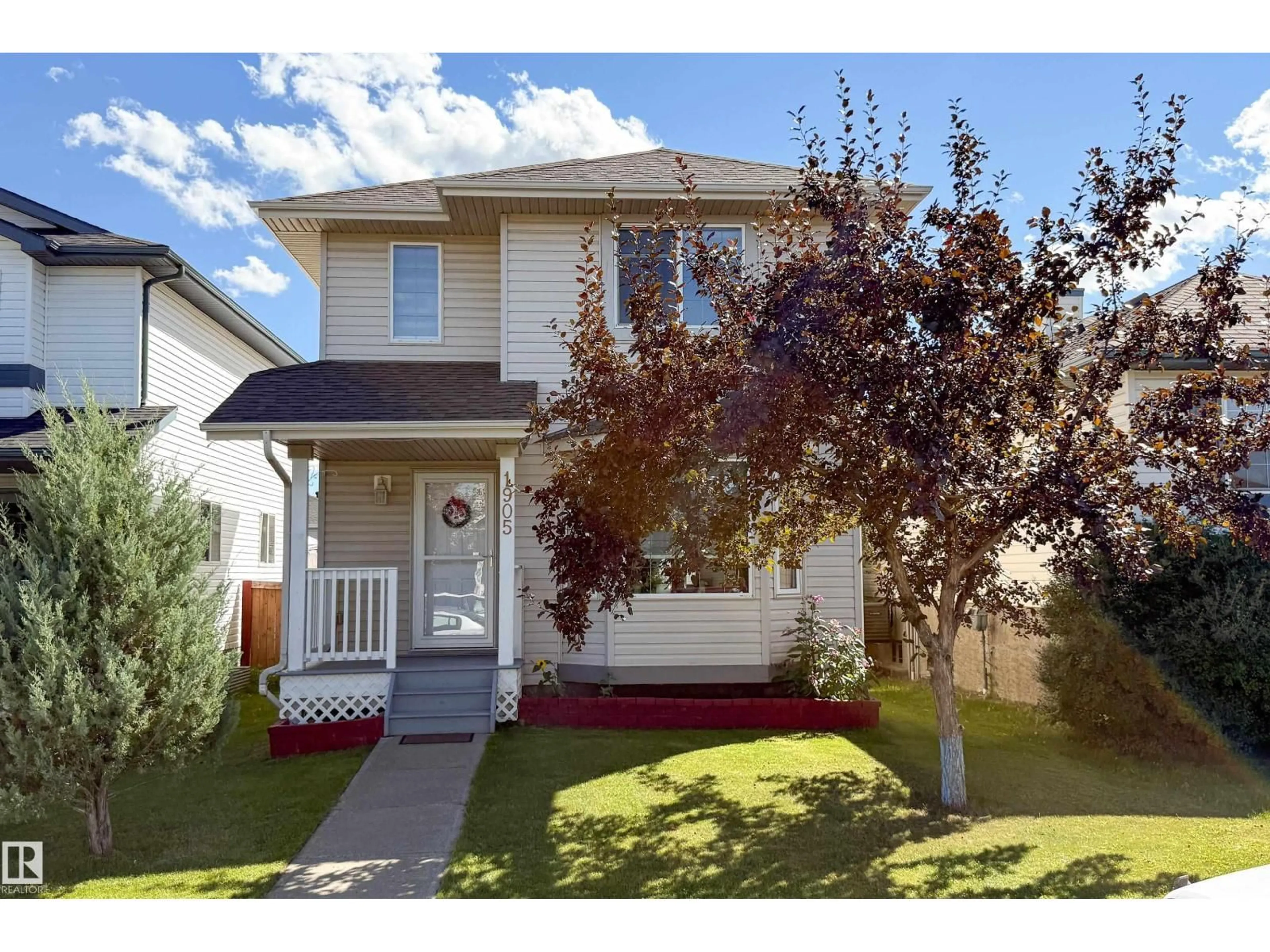 Home with vinyl exterior material, street for 1905 36 AV, Edmonton Alberta T6T1S9