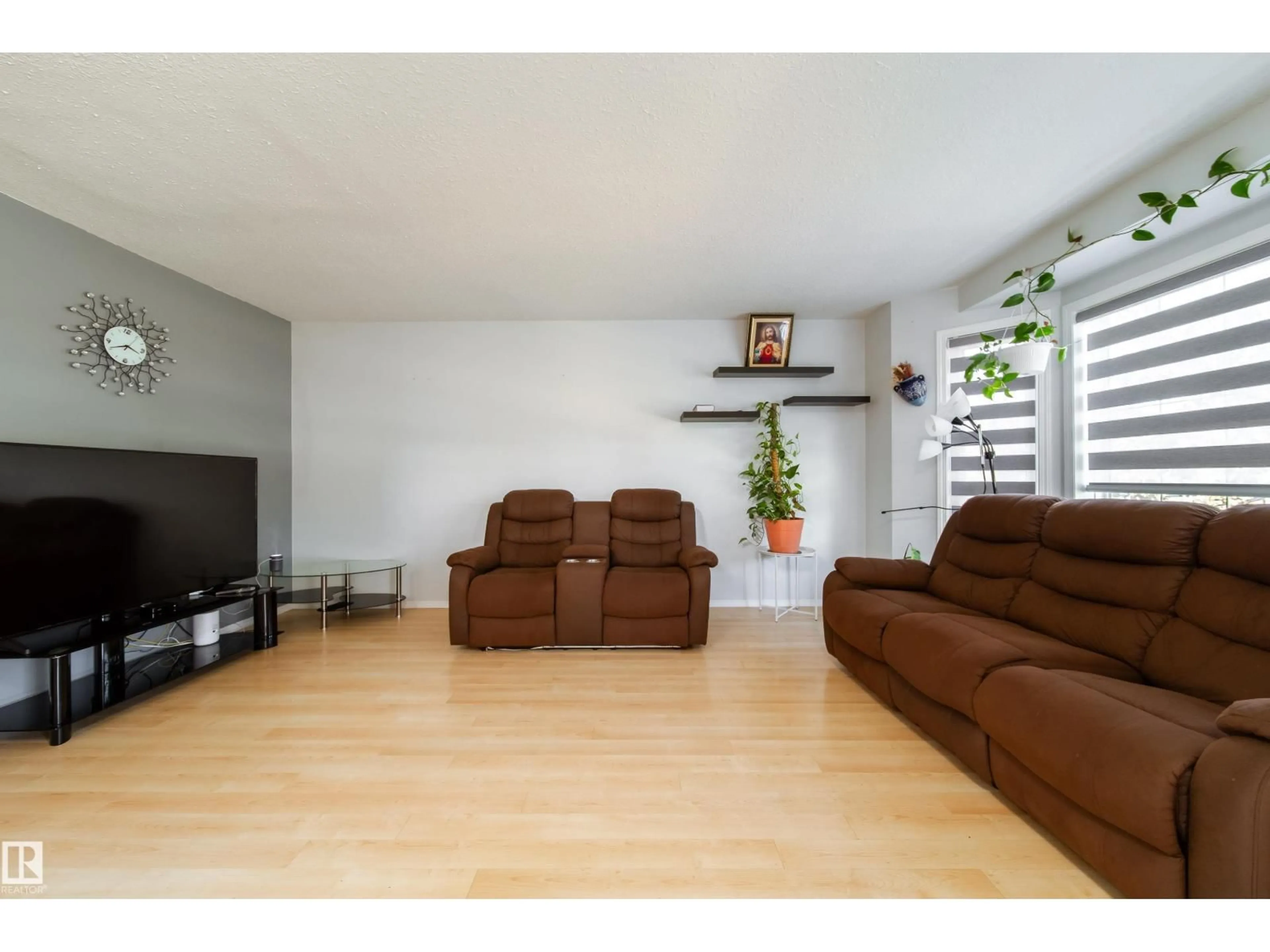 Living room with furniture, wood/laminate floor for 1905 36 AV, Edmonton Alberta T6T1S9