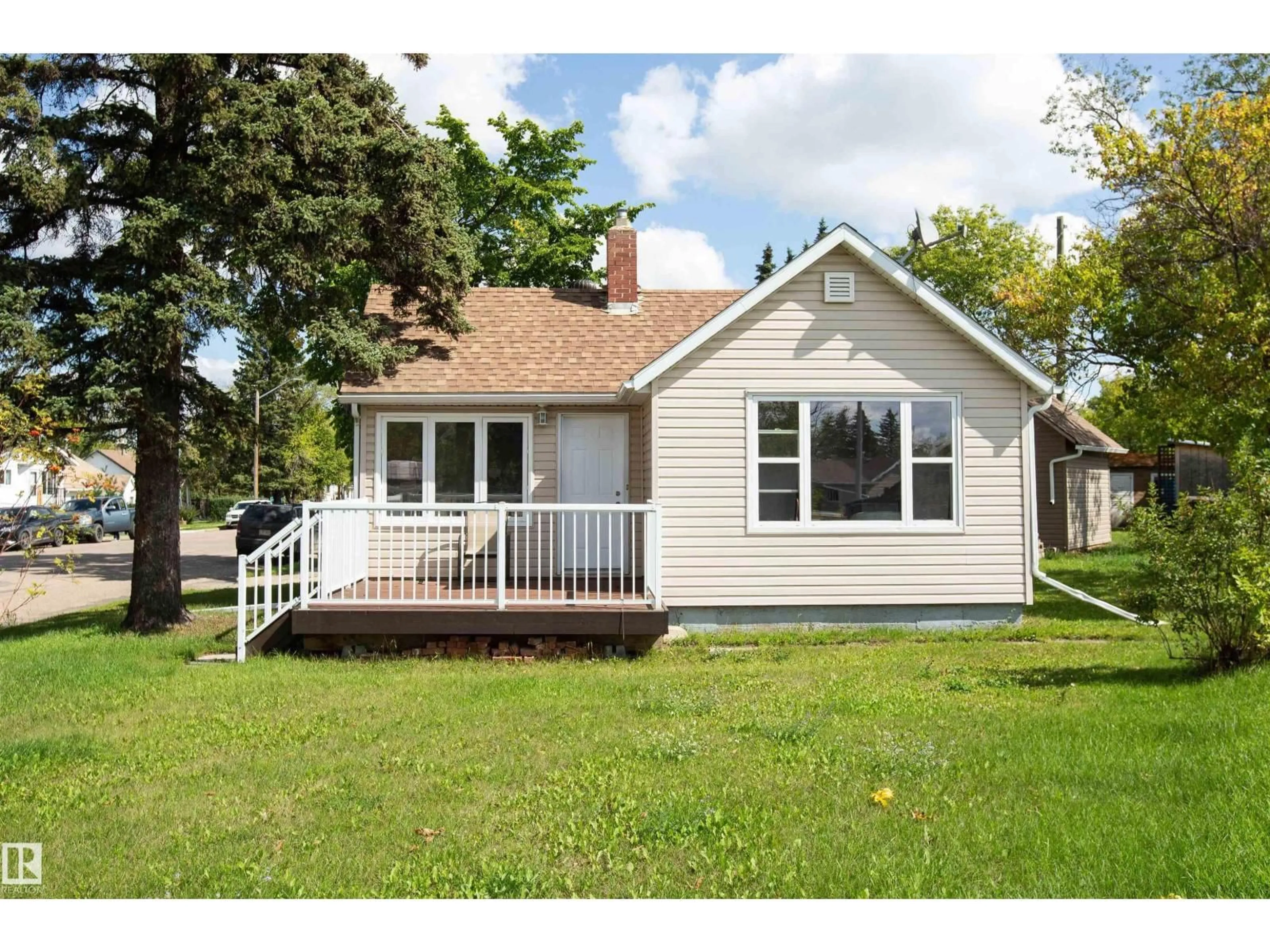 Home with vinyl exterior material, street for 9735 106 ST, Westlock Alberta T7P1S3