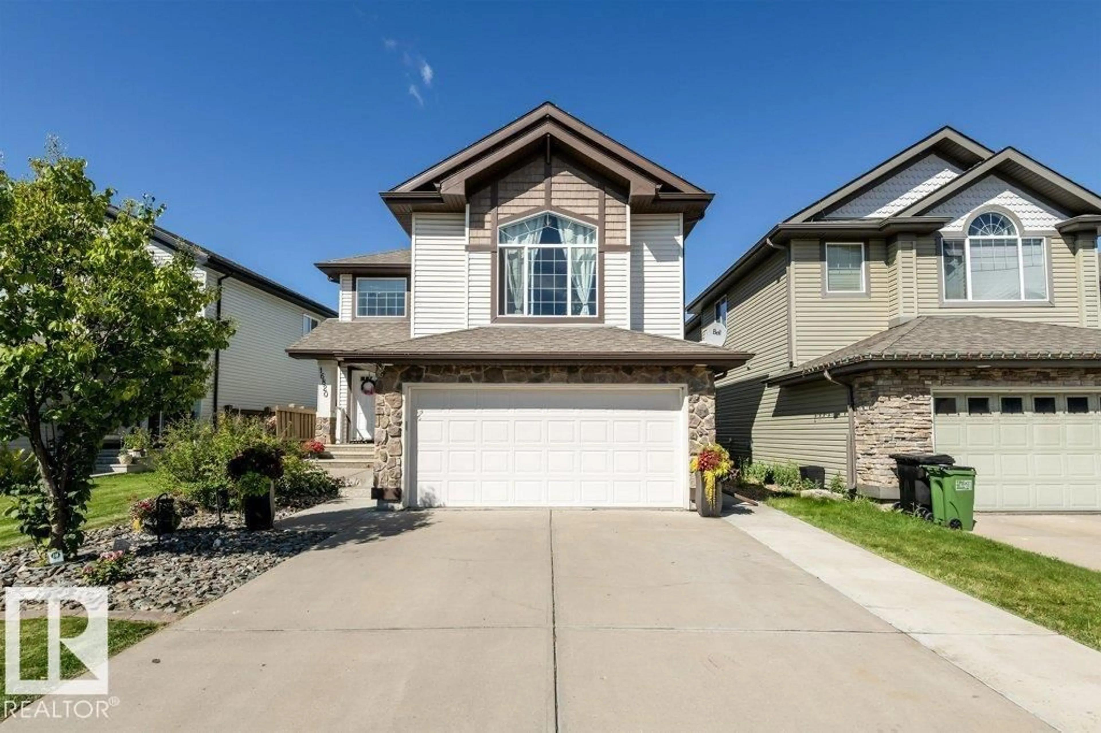 Home with vinyl exterior material, street for 16820 57 ST, Edmonton Alberta T5Y0K4