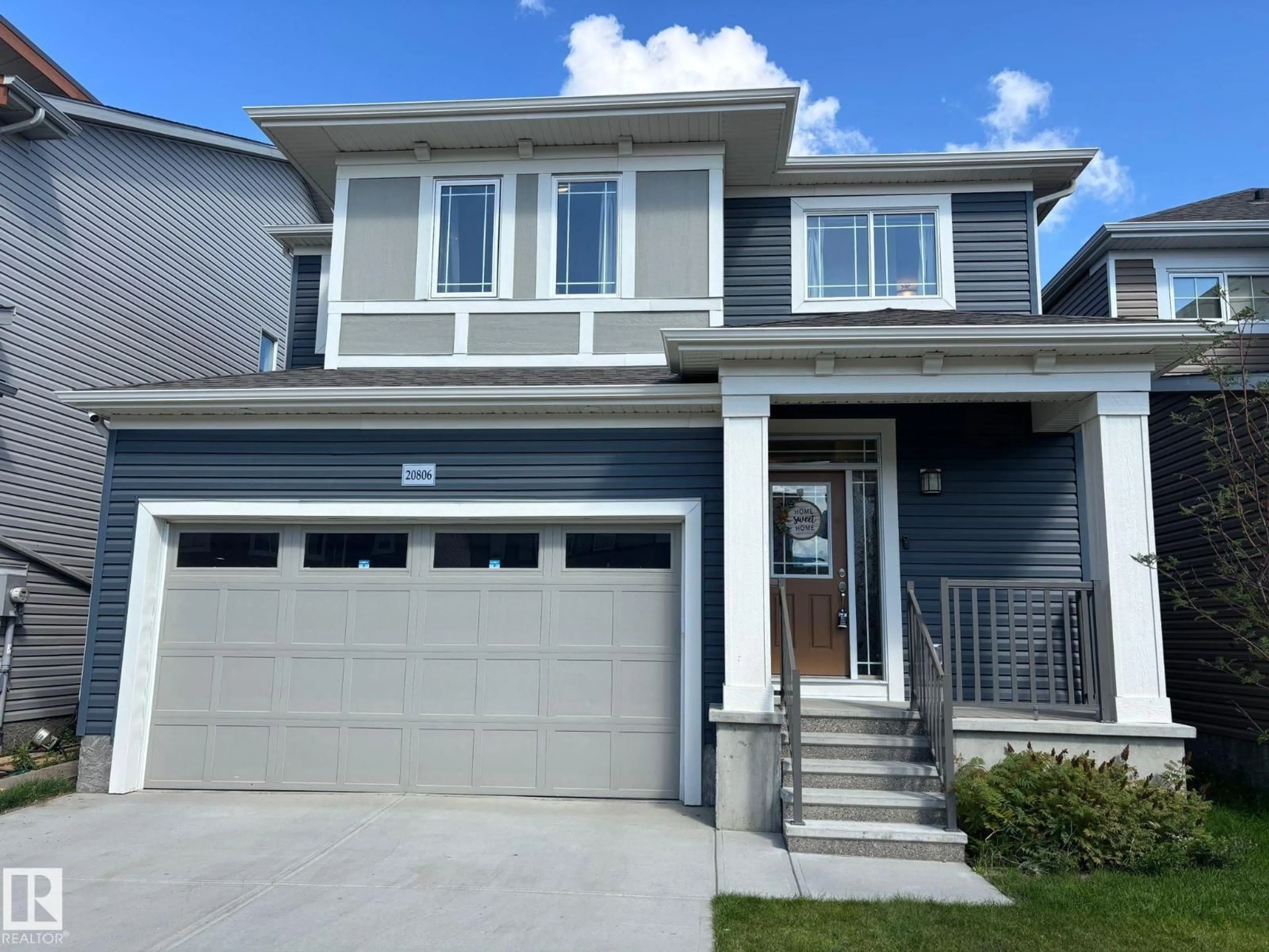Home with vinyl exterior material, street for 20806 19A AV, Edmonton Alberta T6M1R6