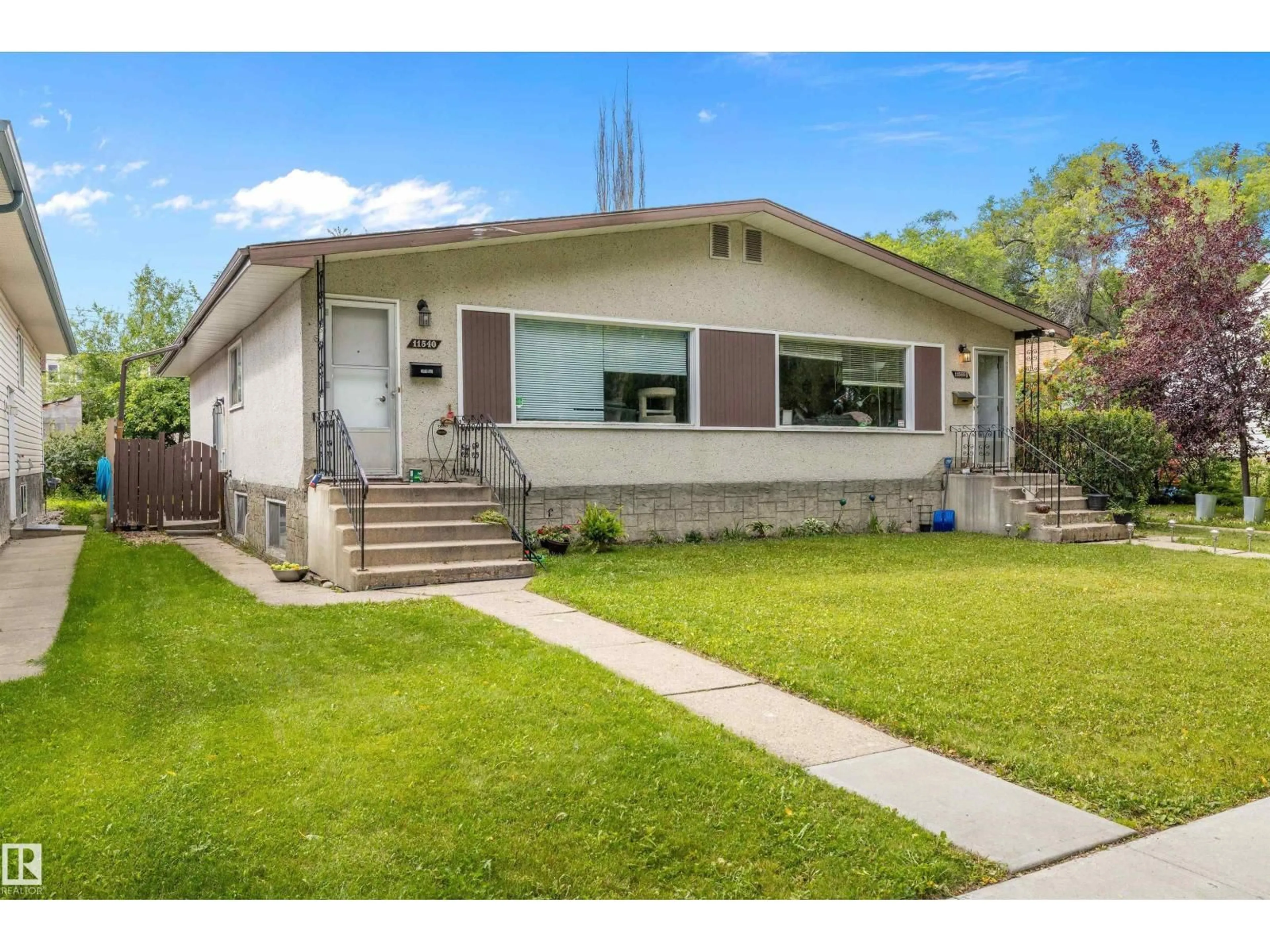 Home with vinyl exterior material, street for NW - 11540 123 ST, Edmonton Alberta T5M0G4