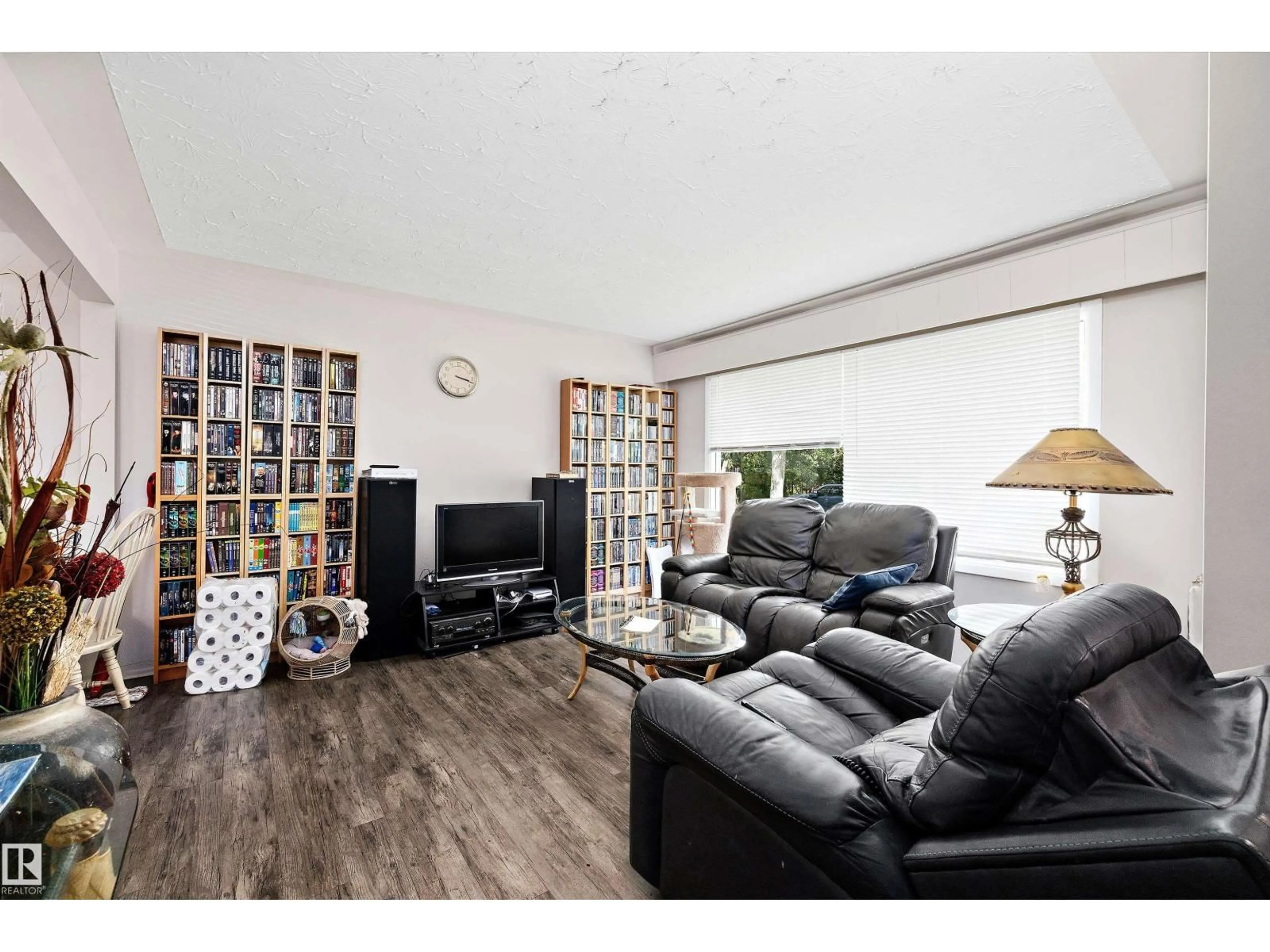Living room with furniture, wood/laminate floor for NW - 11540 123 ST, Edmonton Alberta T5M0G4
