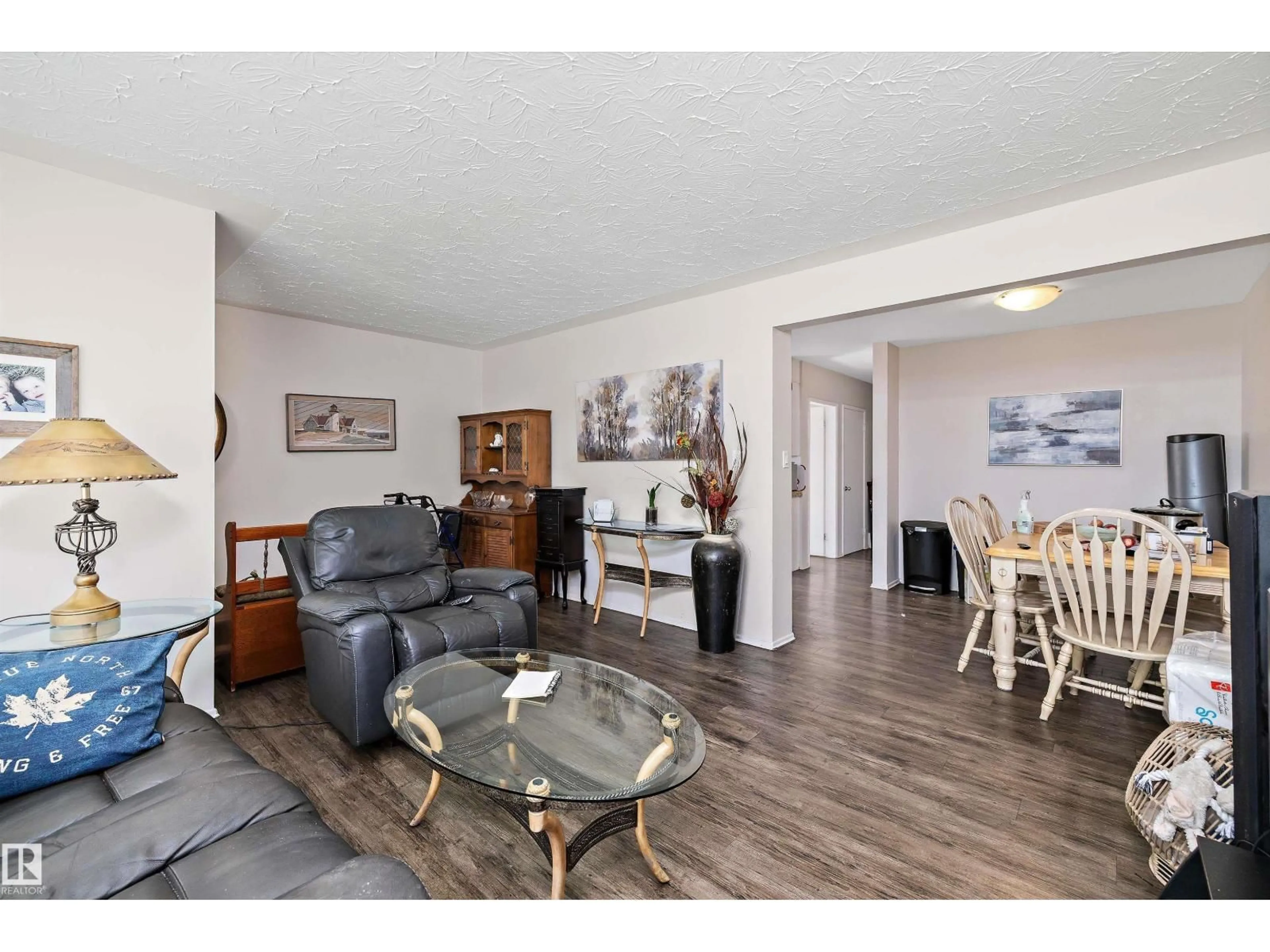 Living room with furniture, wood/laminate floor for NW - 11540 123 ST, Edmonton Alberta T5M0G4