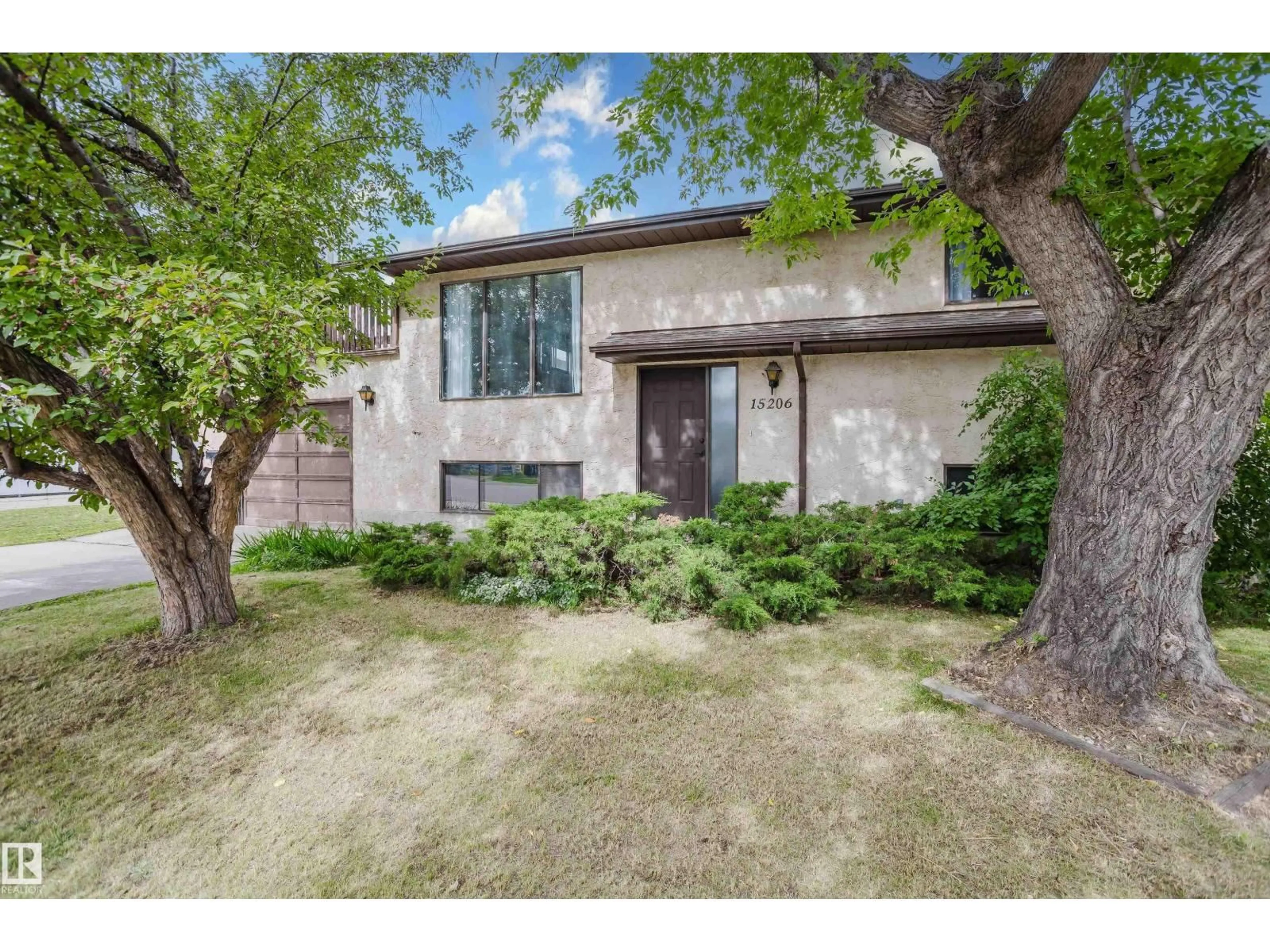 Home with brick exterior material, street for 15206 103 AV NW, Edmonton Alberta T5P4T7