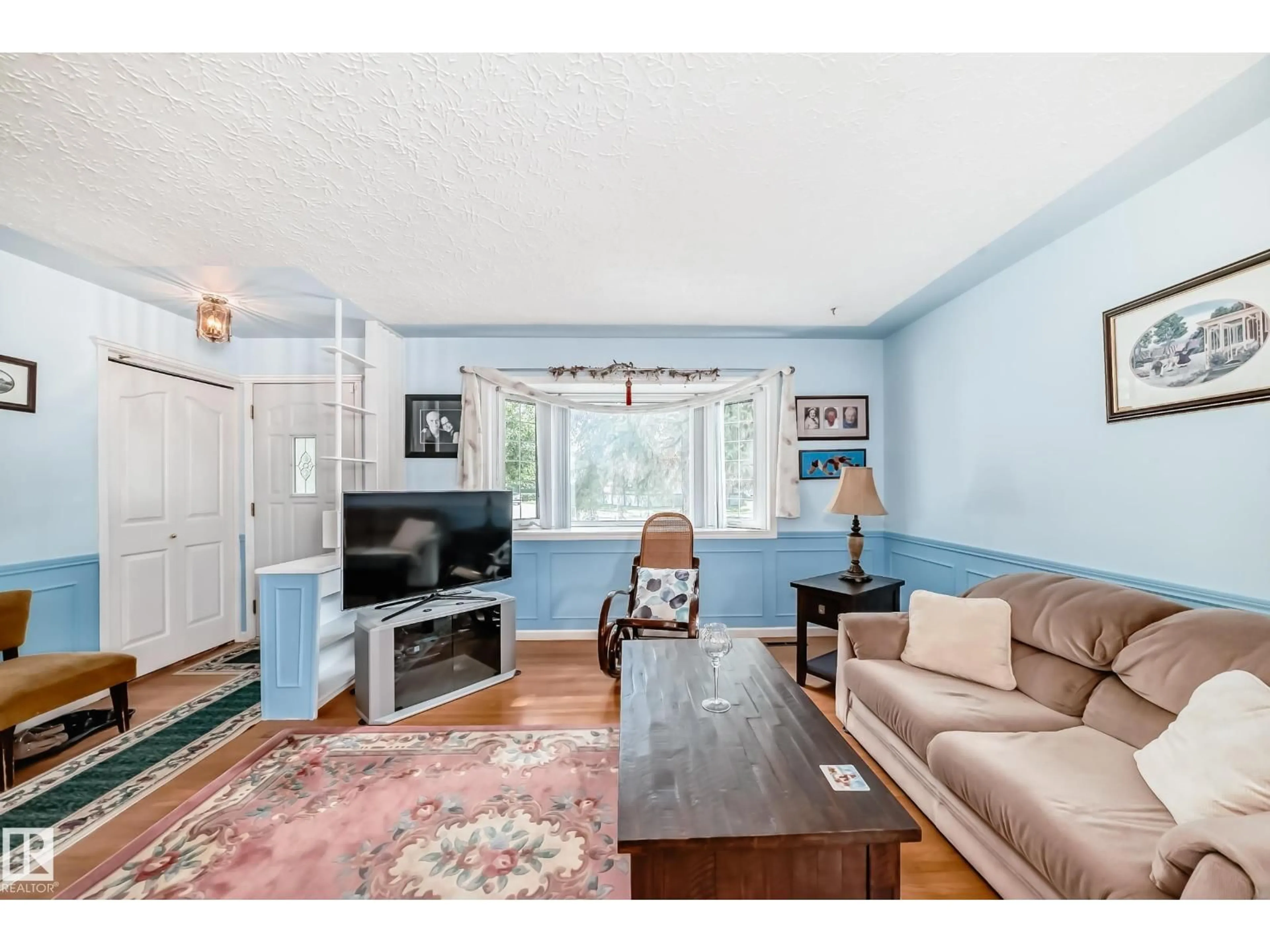 Living room with furniture, wood/laminate floor for NW - 8602 158 ST, Edmonton Alberta T5R2C4