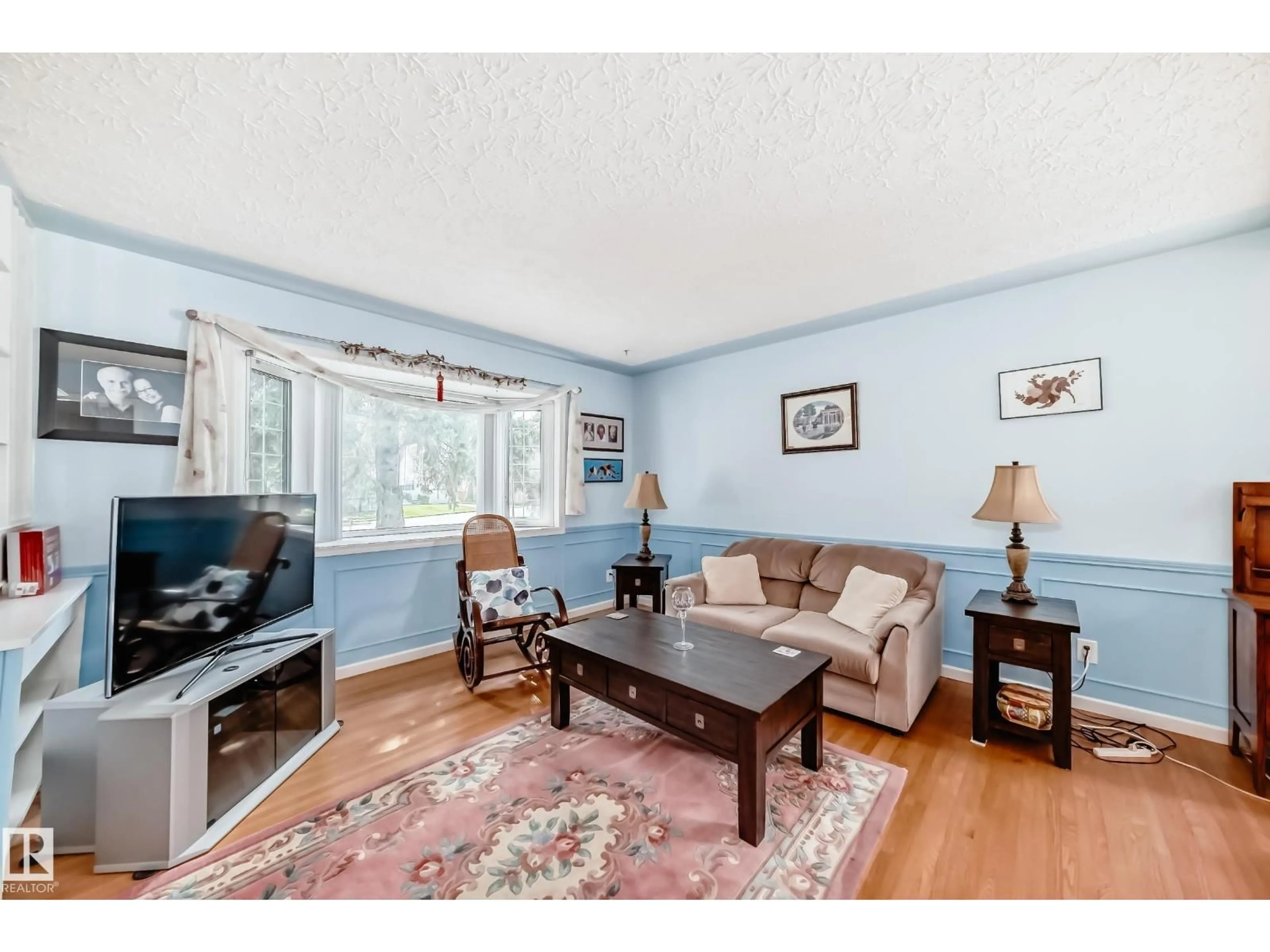 Living room with furniture, wood/laminate floor for NW - 8602 158 ST, Edmonton Alberta T5R2C4