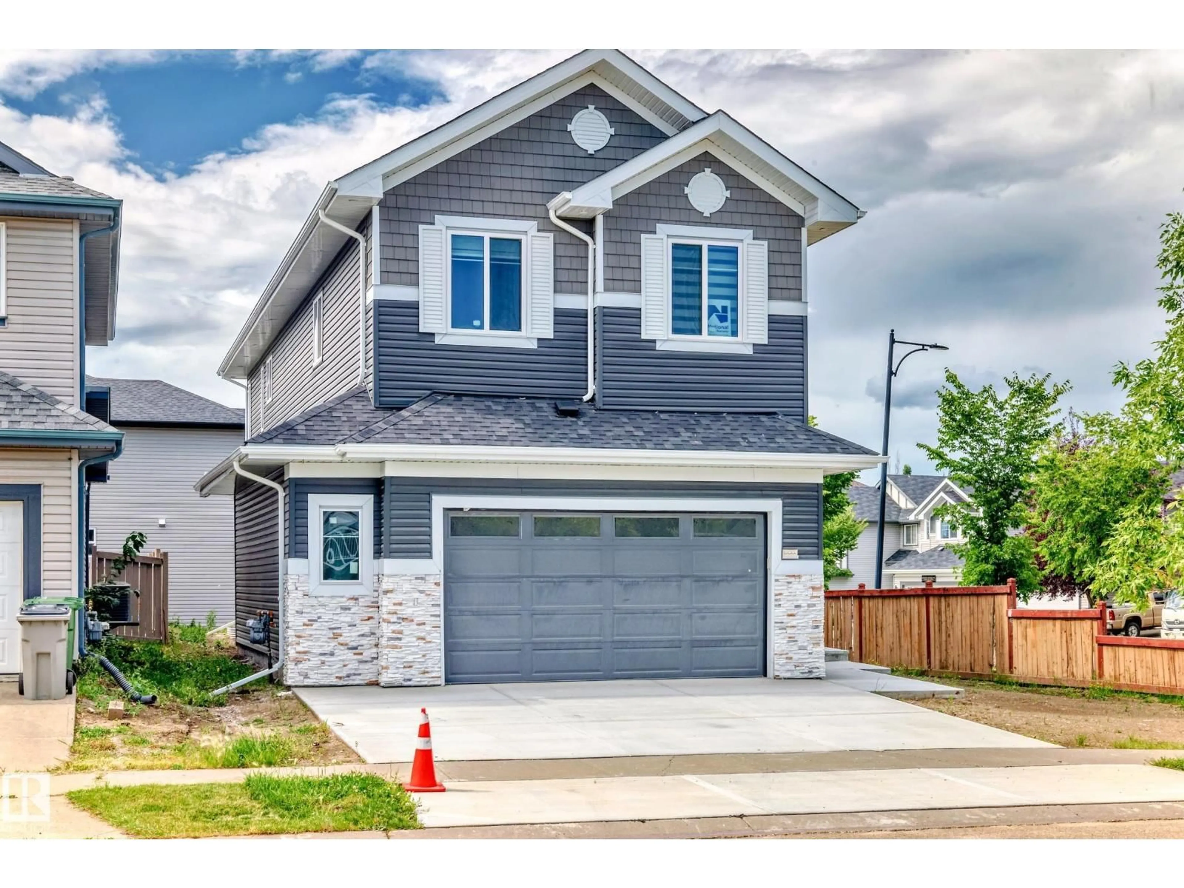 Home with vinyl exterior material, street for 100 RUE MONETTE, Beaumont Alberta T4X1S8