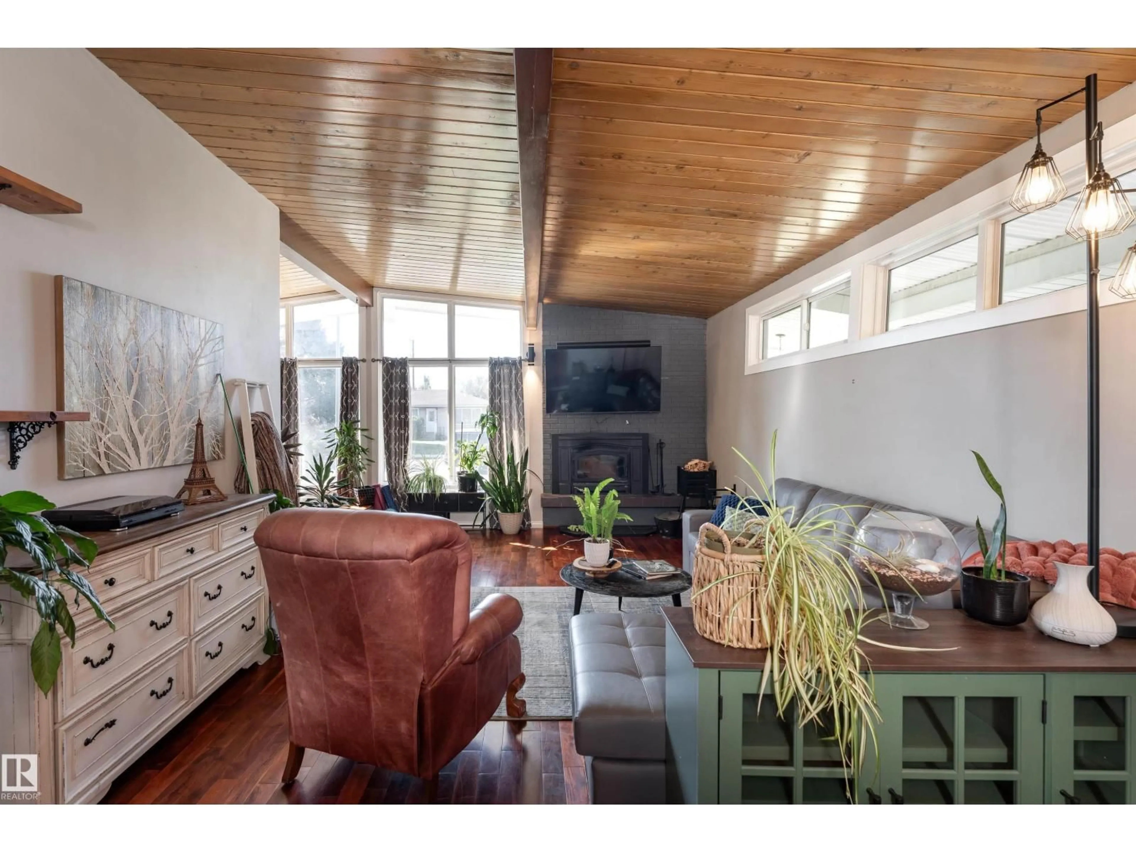 Living room with furniture, wood/laminate floor for 6004 102 AV, Edmonton Alberta T6A0N4