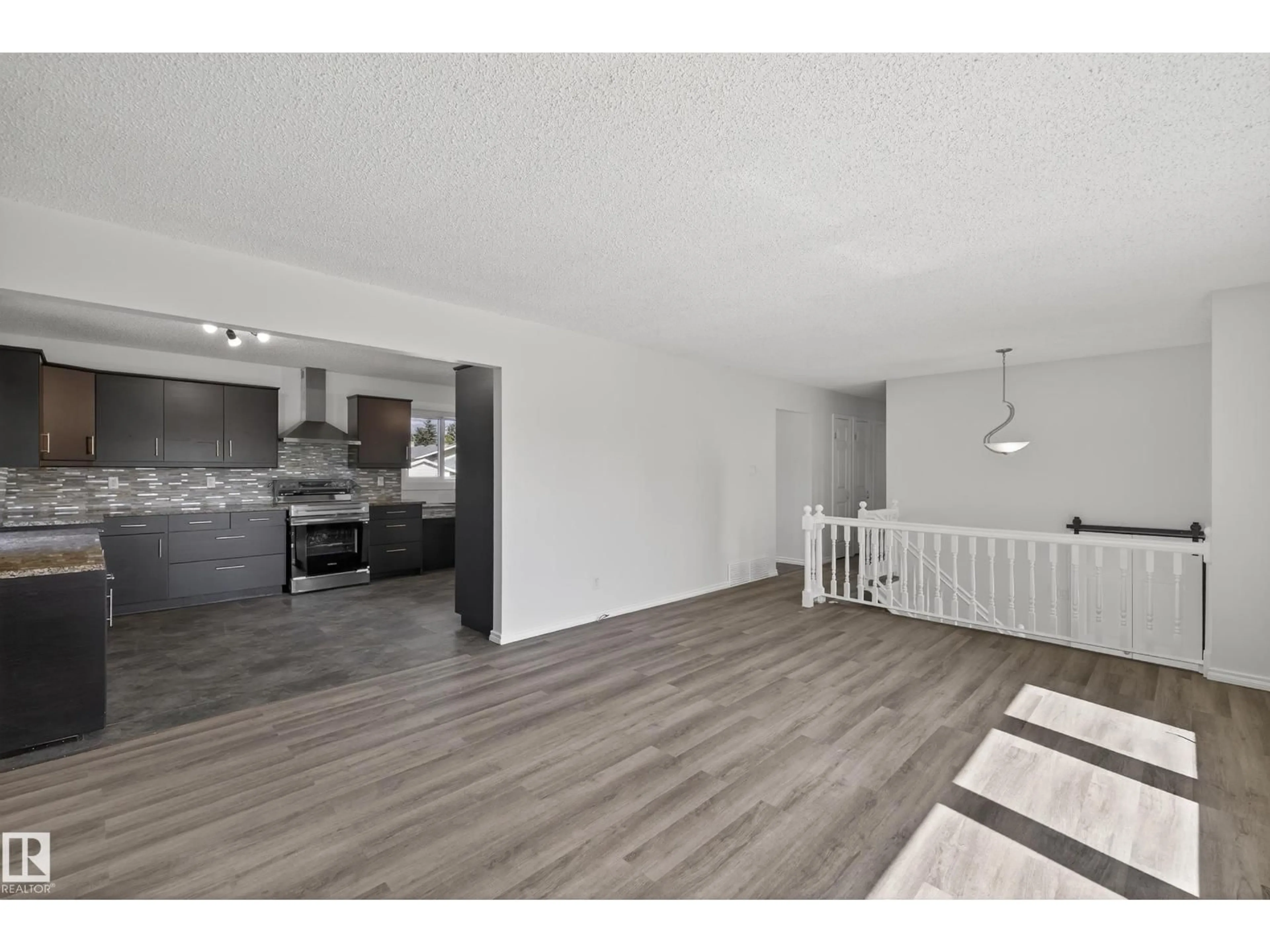 Open concept kitchen, wood/laminate floor for 4402 42B AV, Leduc Alberta T9E4R9