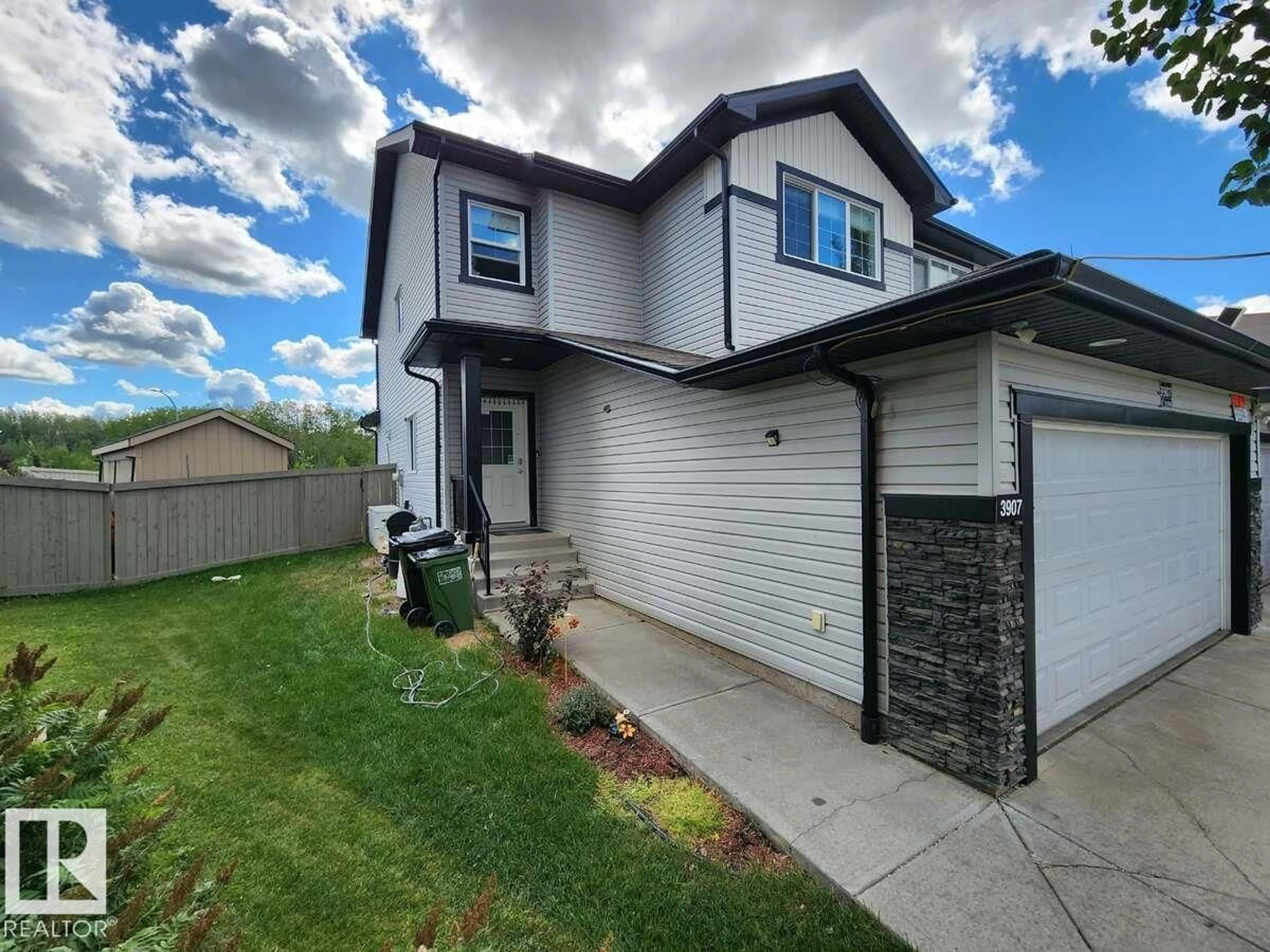 Home with vinyl exterior material, street for 3907 6 ST, Edmonton Alberta T6T0T5