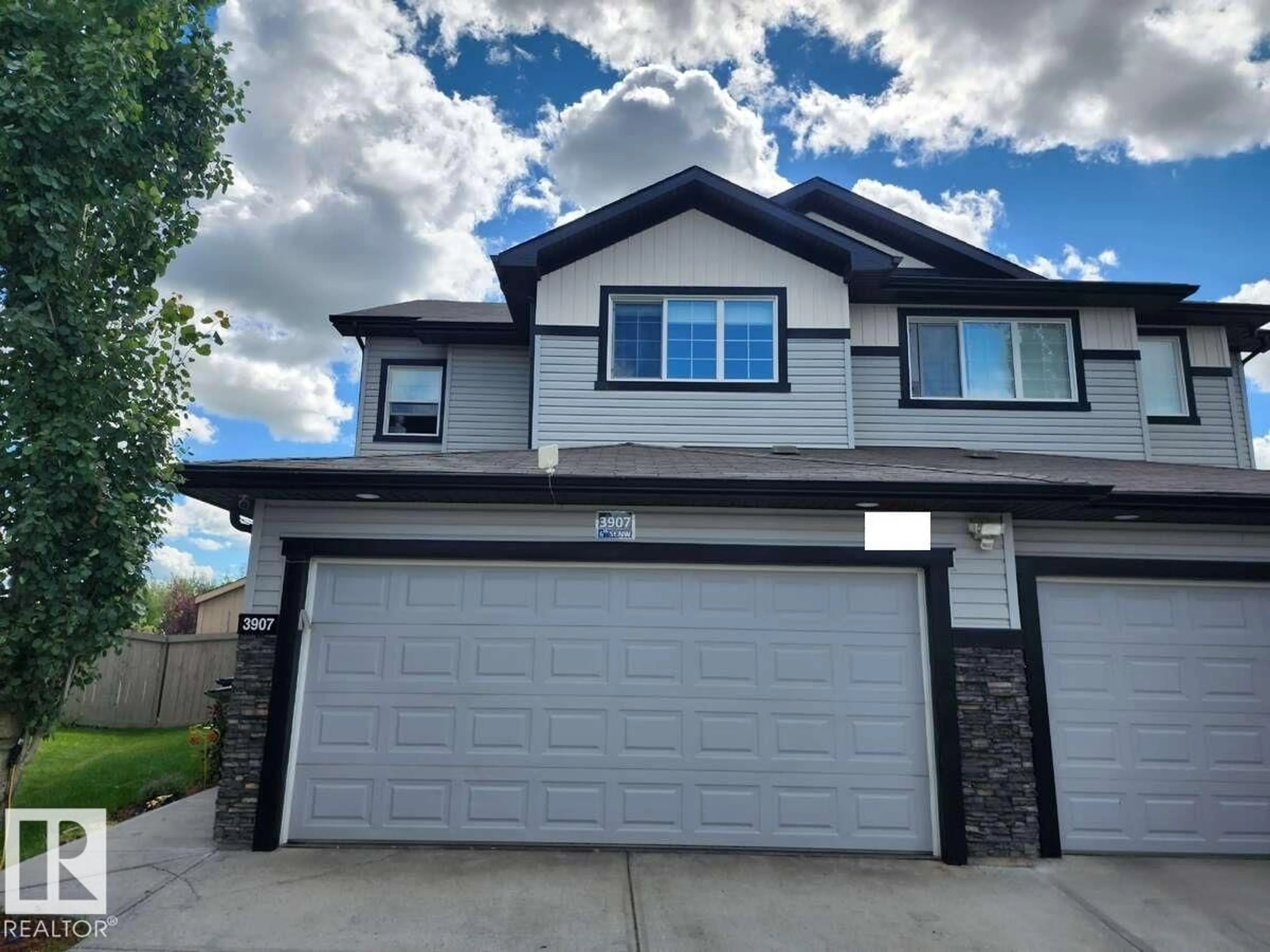 Home with vinyl exterior material, street for 3907 6 ST, Edmonton Alberta T6T0T5