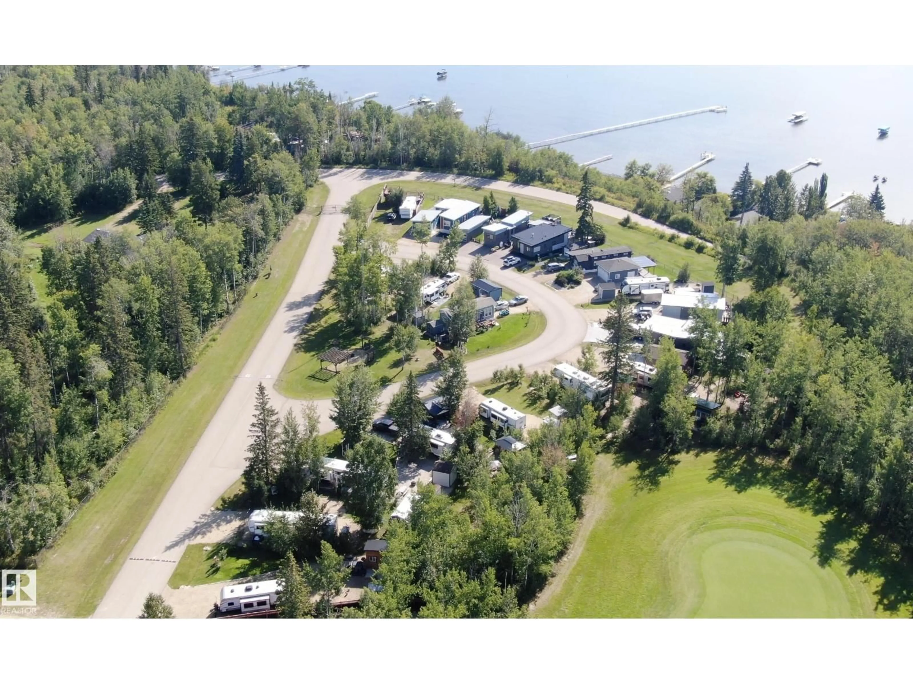 A pic from outside/outdoor area/front of a property/back of a property/a pic from drone, water/lake/river/ocean view for 64 53206 RGE ROAD 55 A, Rural Parkland County Alberta T0E2B0