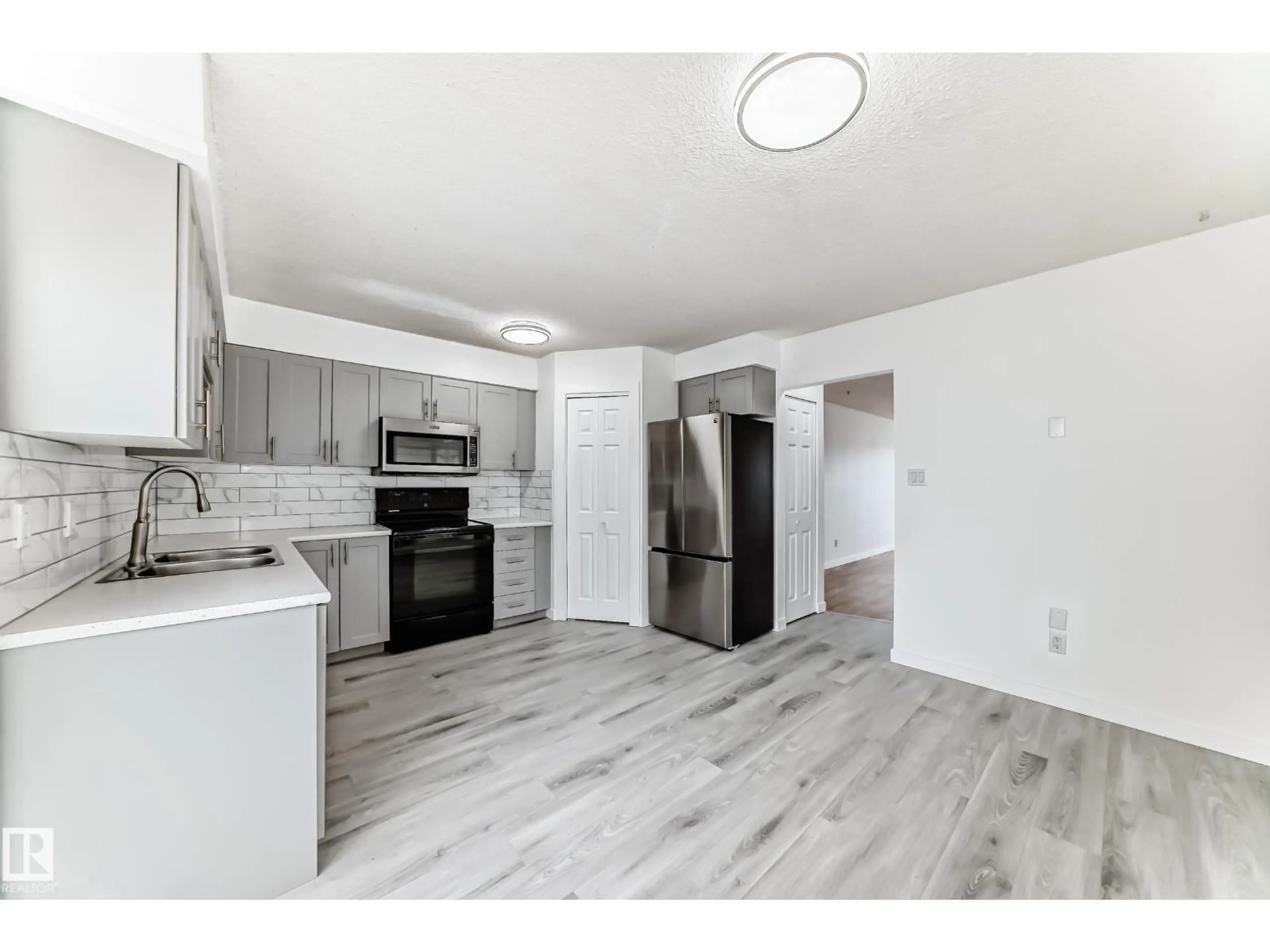 Open concept kitchen, unknown for NW - 13116 31 STRRET, Edmonton Alberta T5A3A4