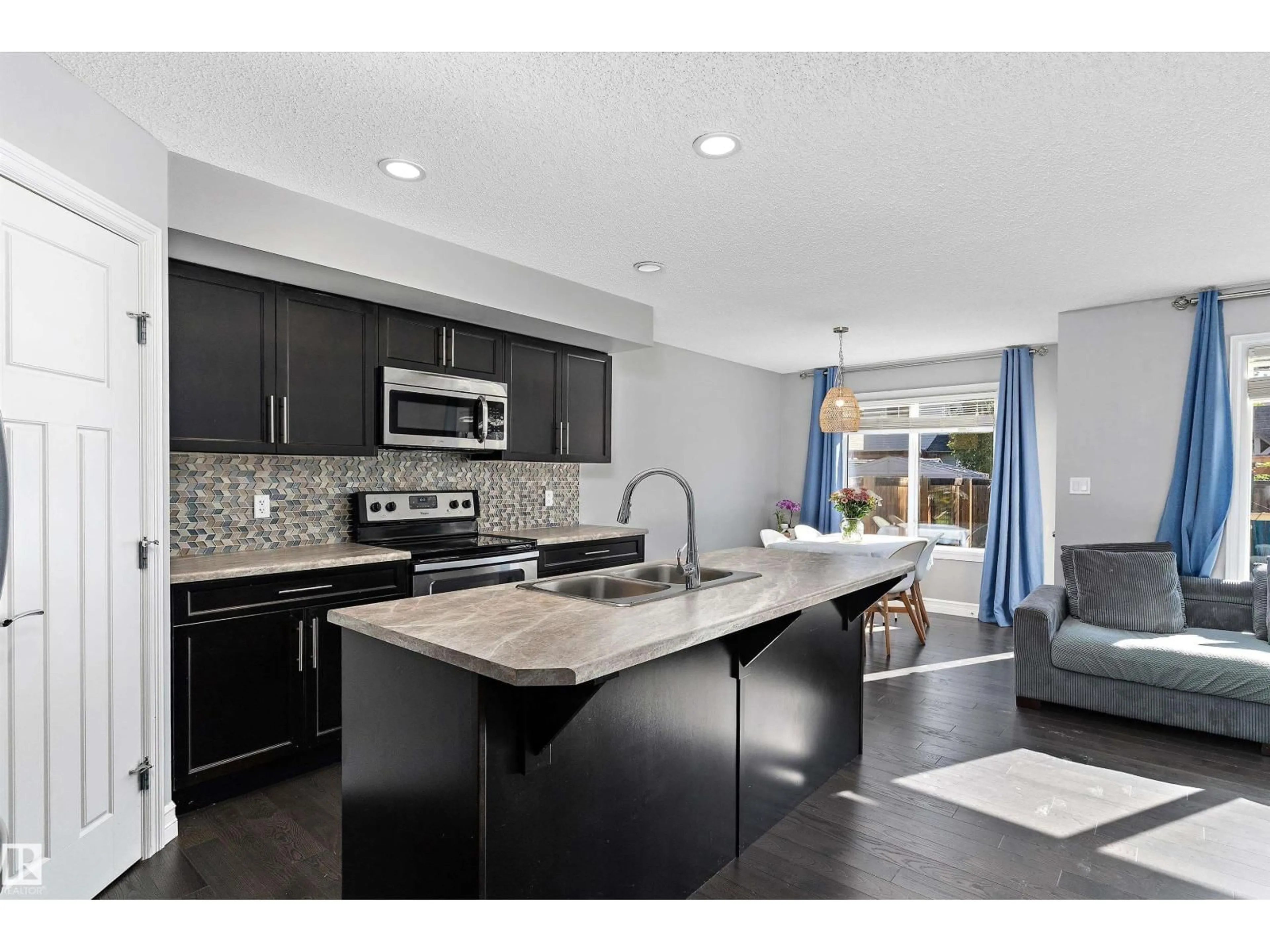 Open concept kitchen, ceramic/tile floor for 5813 64 ST, Beaumont Alberta T4X1Z1