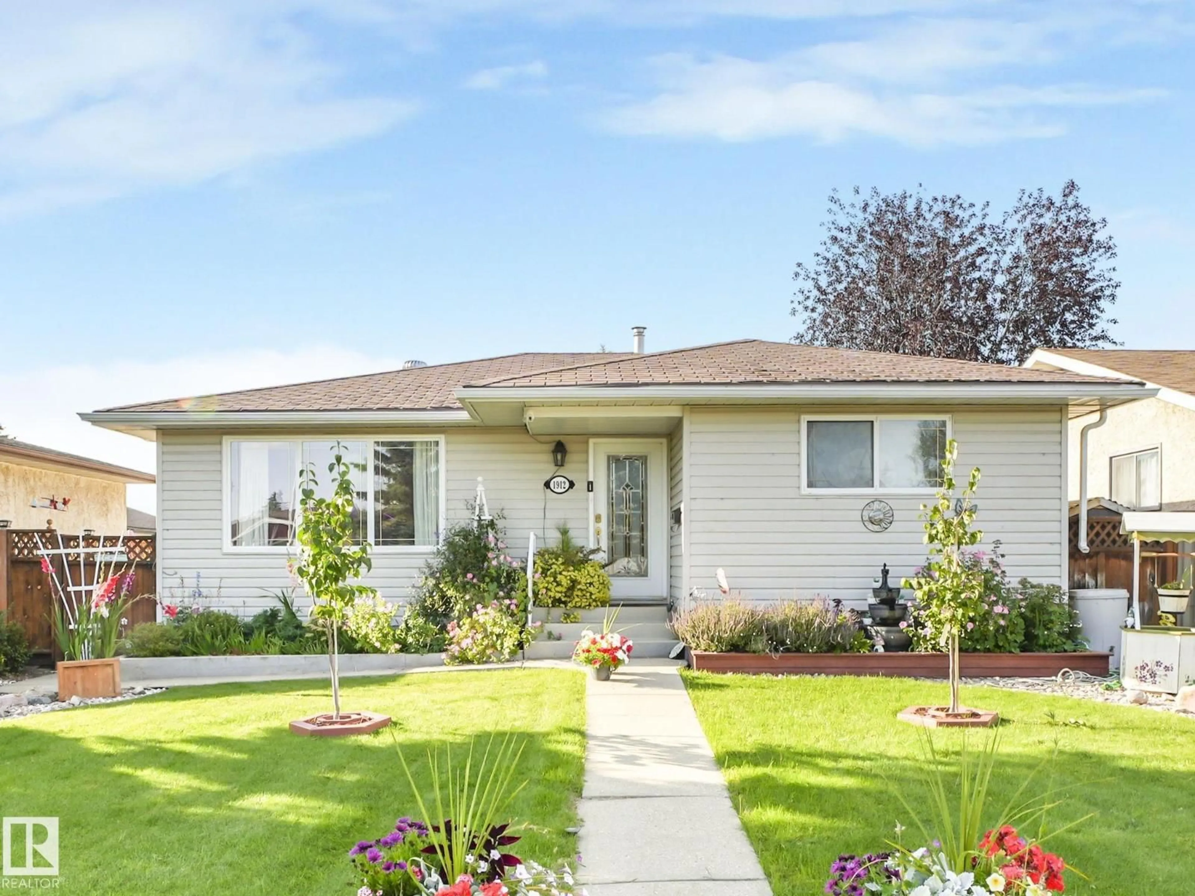 Home with vinyl exterior material, street for 1912 LAKEWOOD RD, Edmonton Alberta T6K3W8