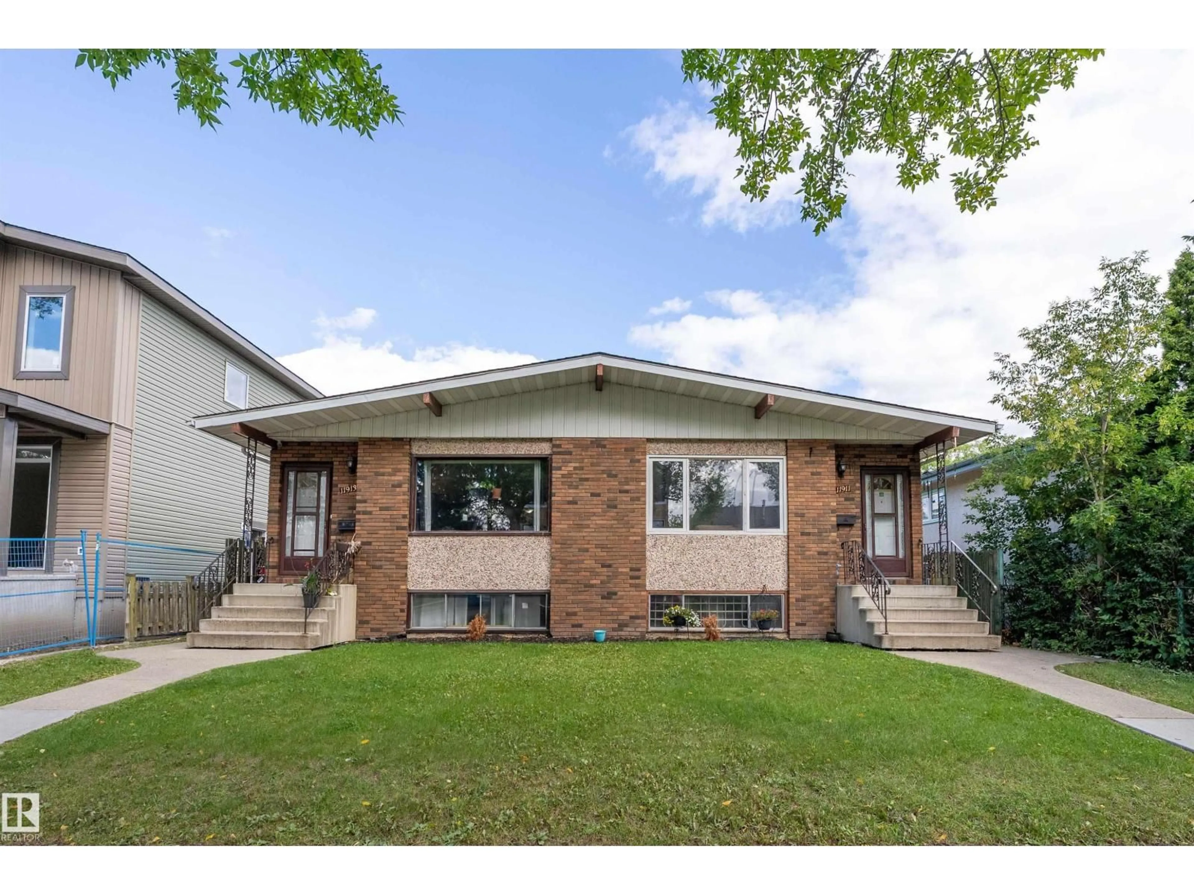 Home with brick exterior material, street for 11911/11913 123 ST, Edmonton Alberta T5M0G4