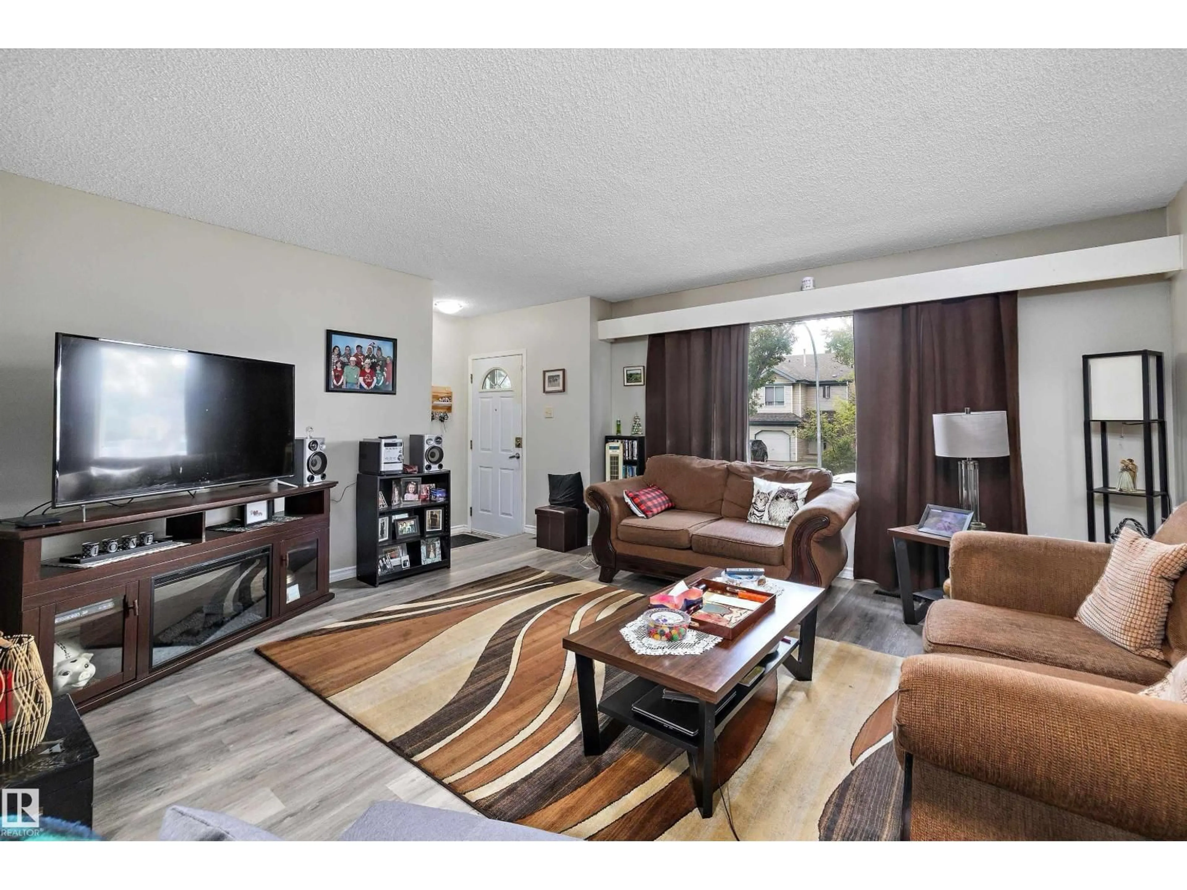 Living room with furniture, unknown for 11911/11913 123 ST, Edmonton Alberta T5M0G4
