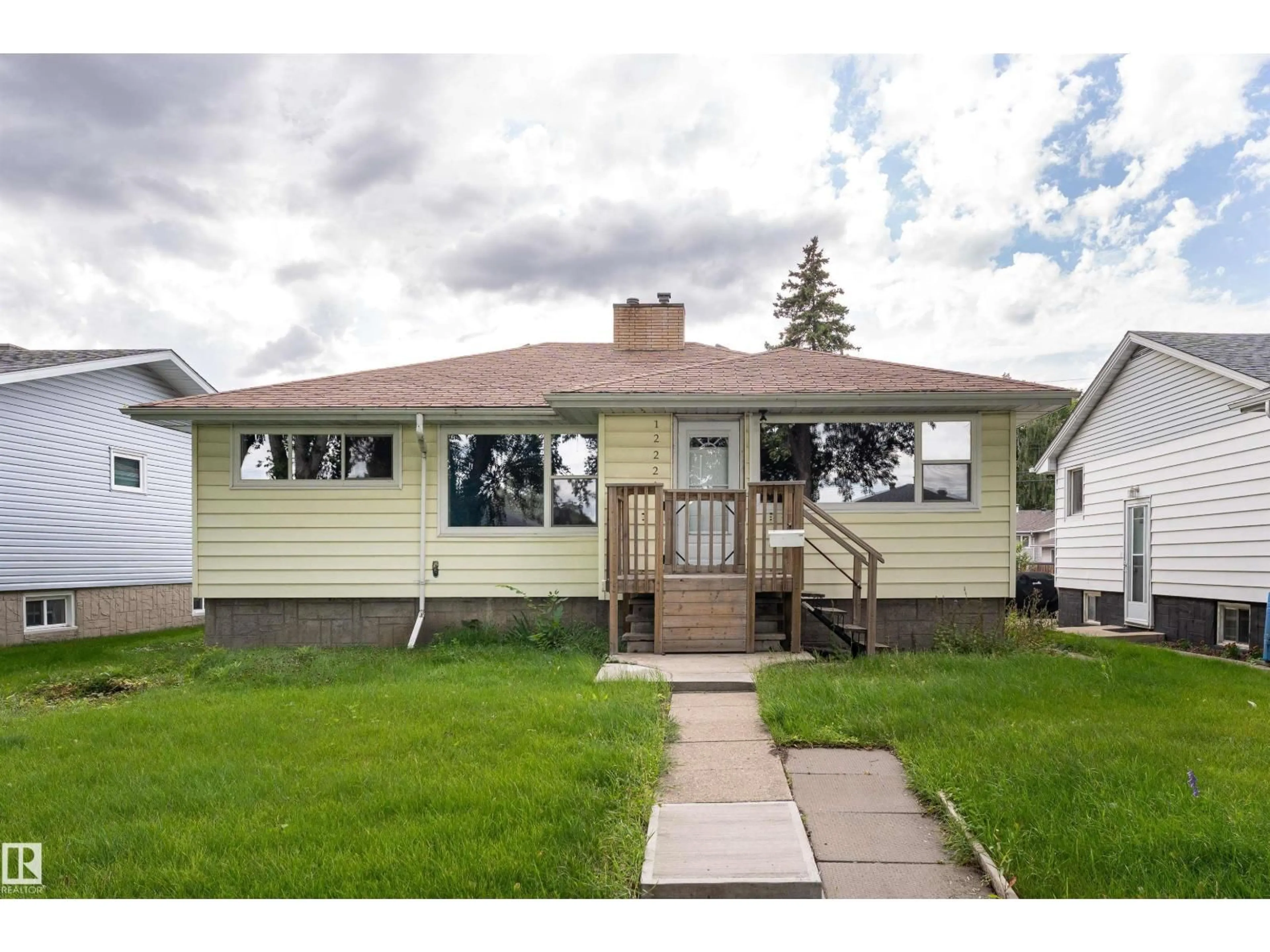 Home with vinyl exterior material, street for 12220 51 ST, Edmonton Alberta T5W3H2