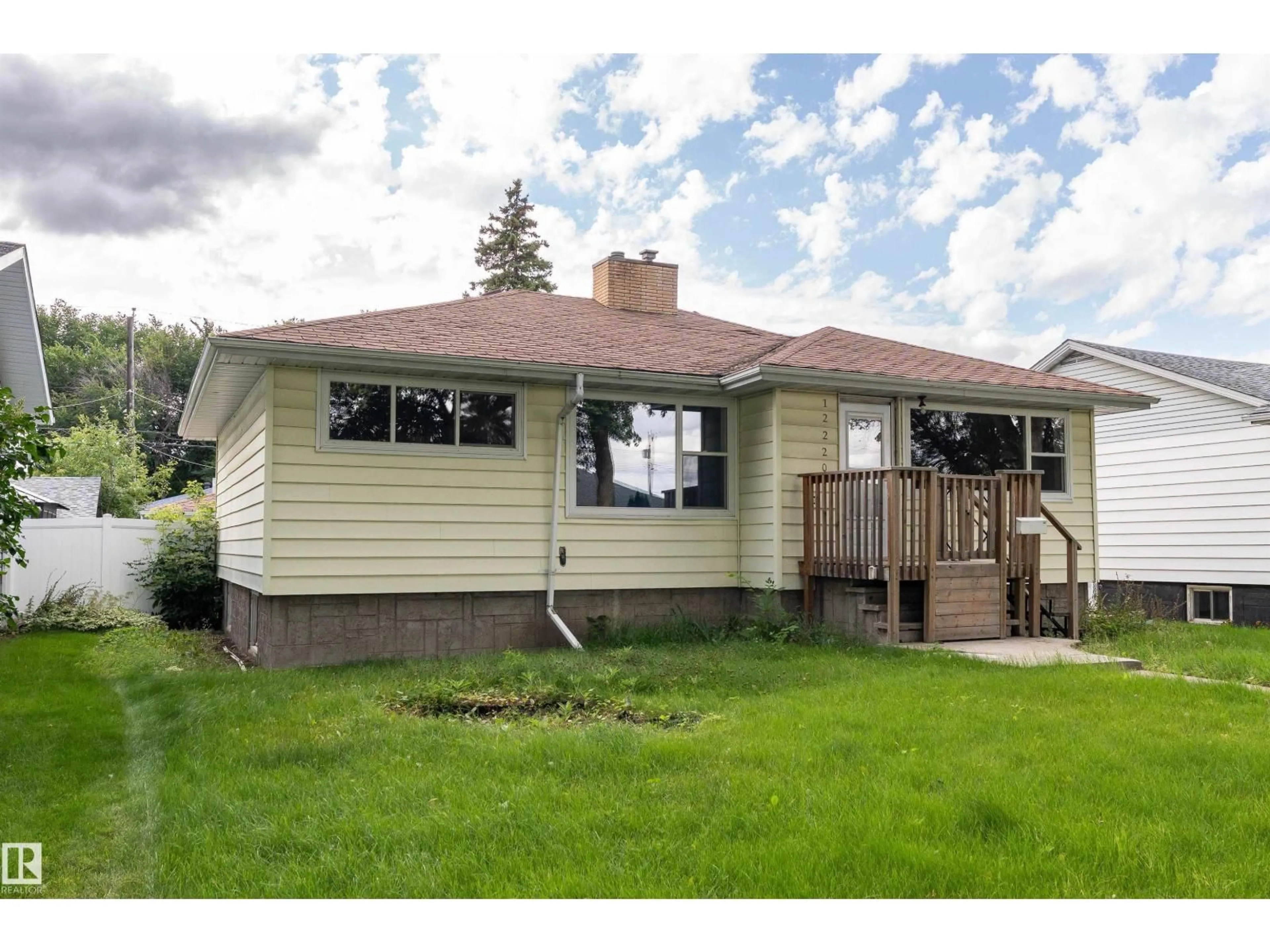 Home with vinyl exterior material, street for 12220 51 ST, Edmonton Alberta T5W3H2