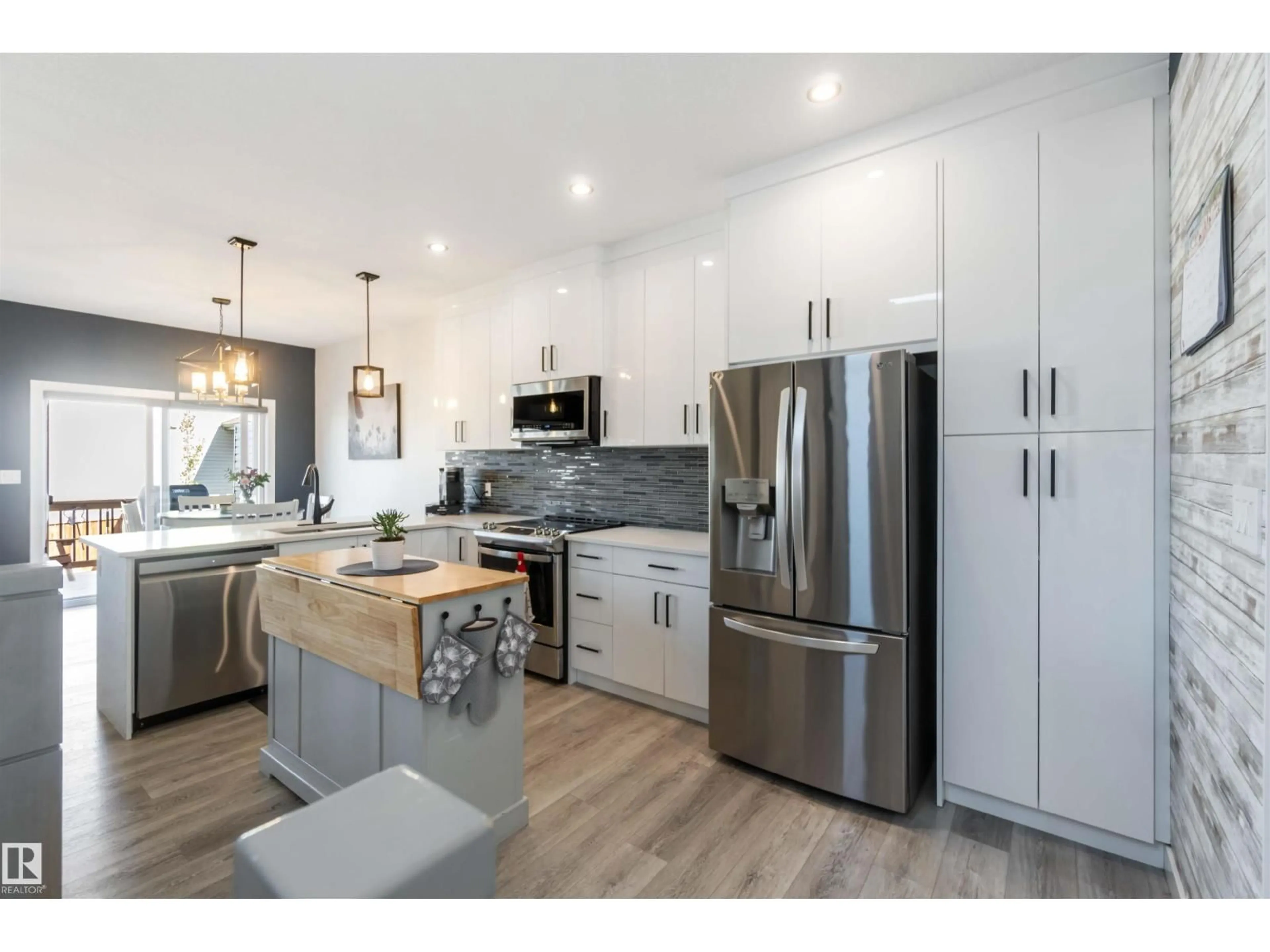 Open concept kitchen, wood/laminate floor for 70 SPRINGBROOK WD, Spruce Grove Alberta T7X0X9