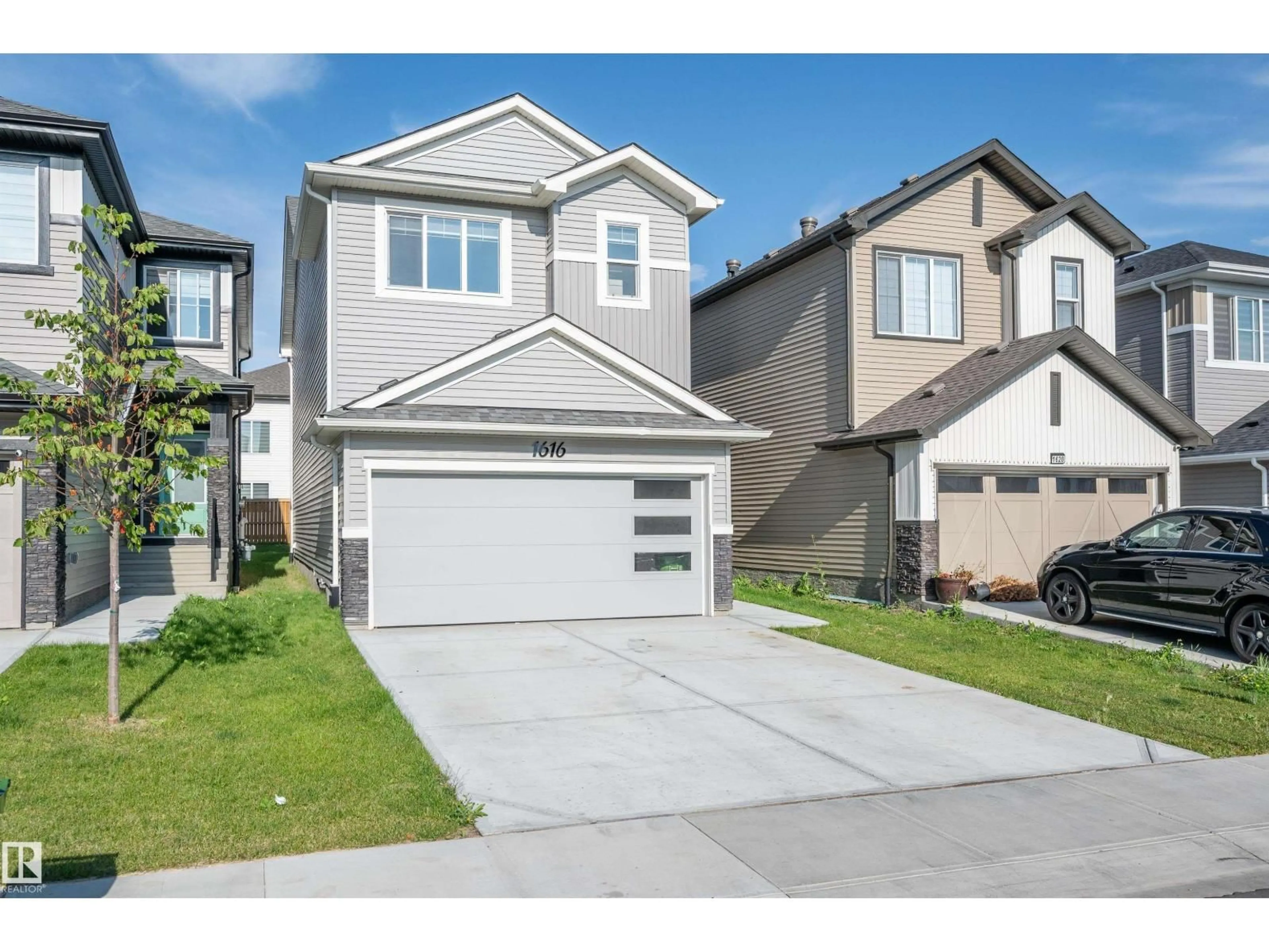 Home with vinyl exterior material, street for 1616 16 ST, Edmonton Alberta T6T2S1