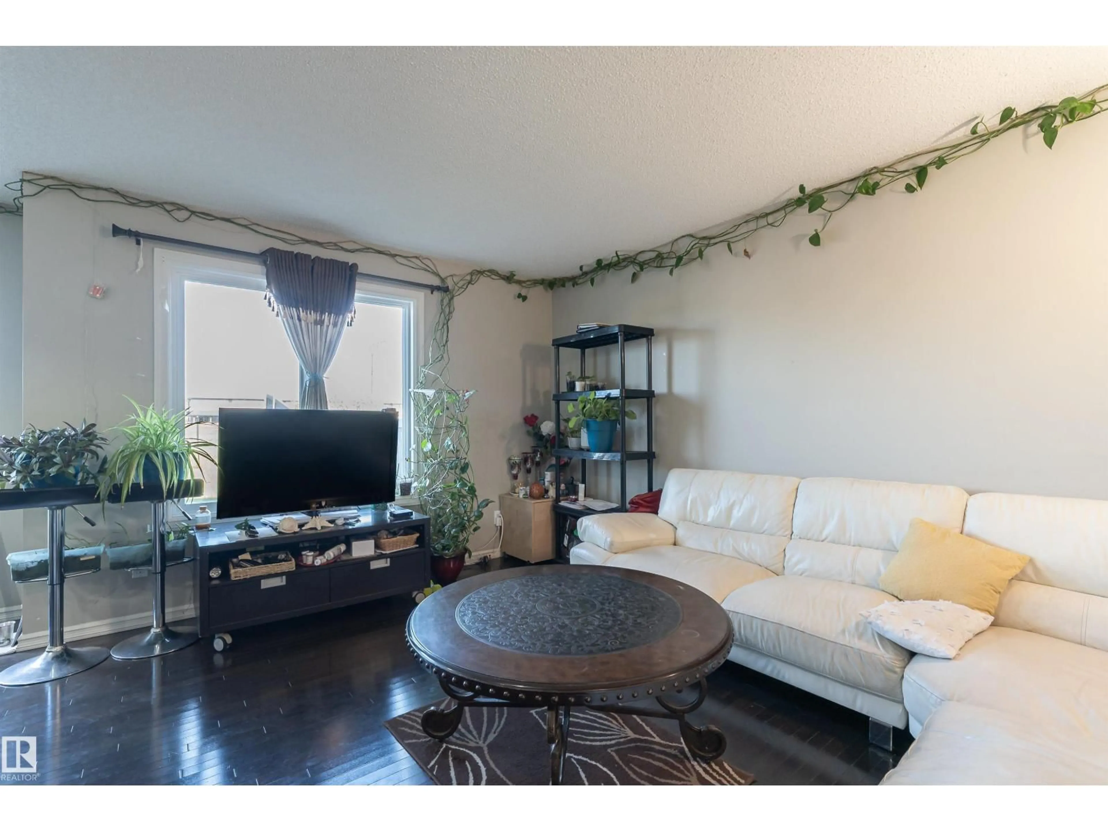 Living room with furniture, wood/laminate floor for 1841 28 ST, Edmonton Alberta T6T0N8