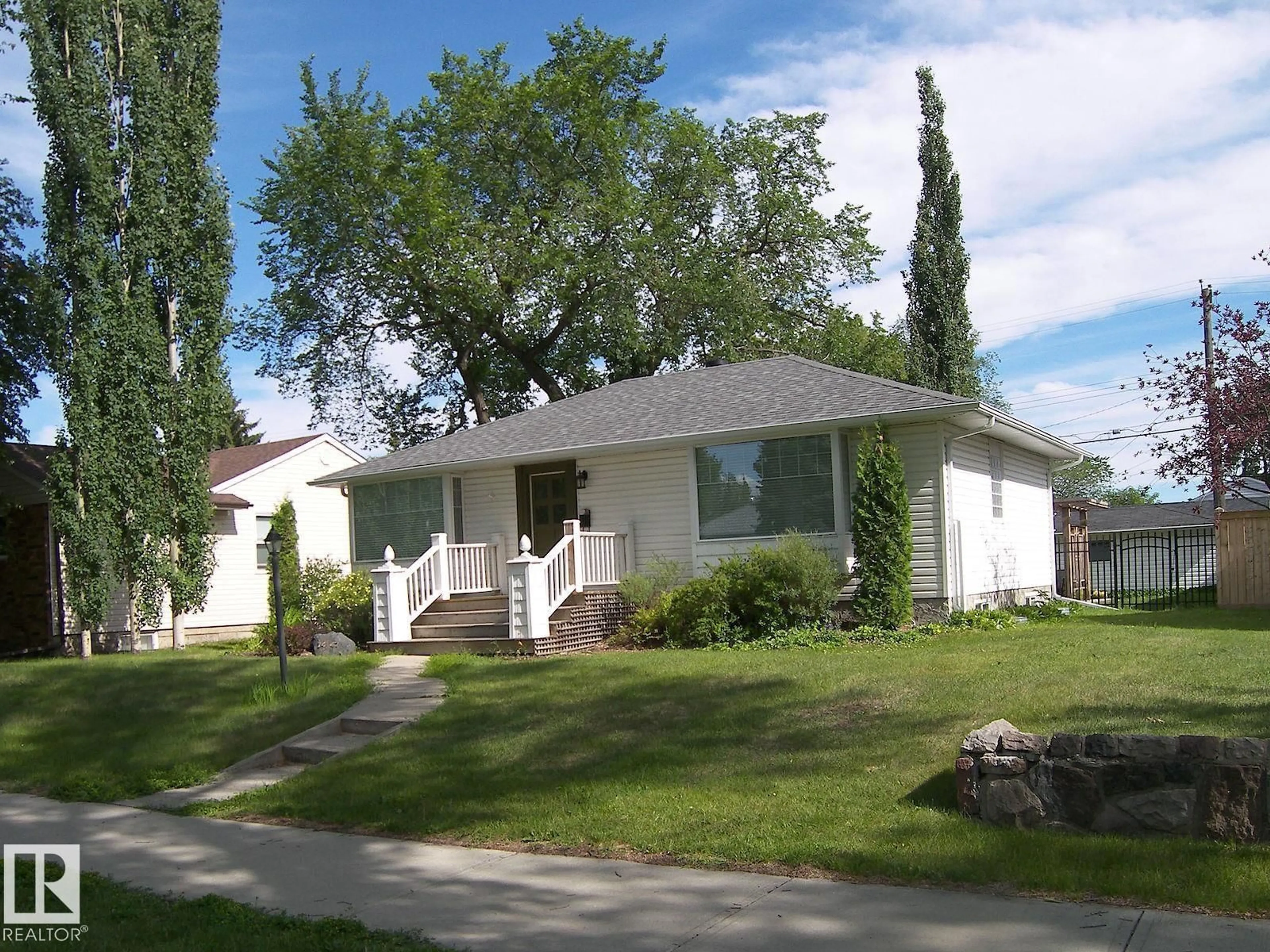 Home with vinyl exterior material, street for 14347 92A AV, Edmonton Alberta T5R5E3