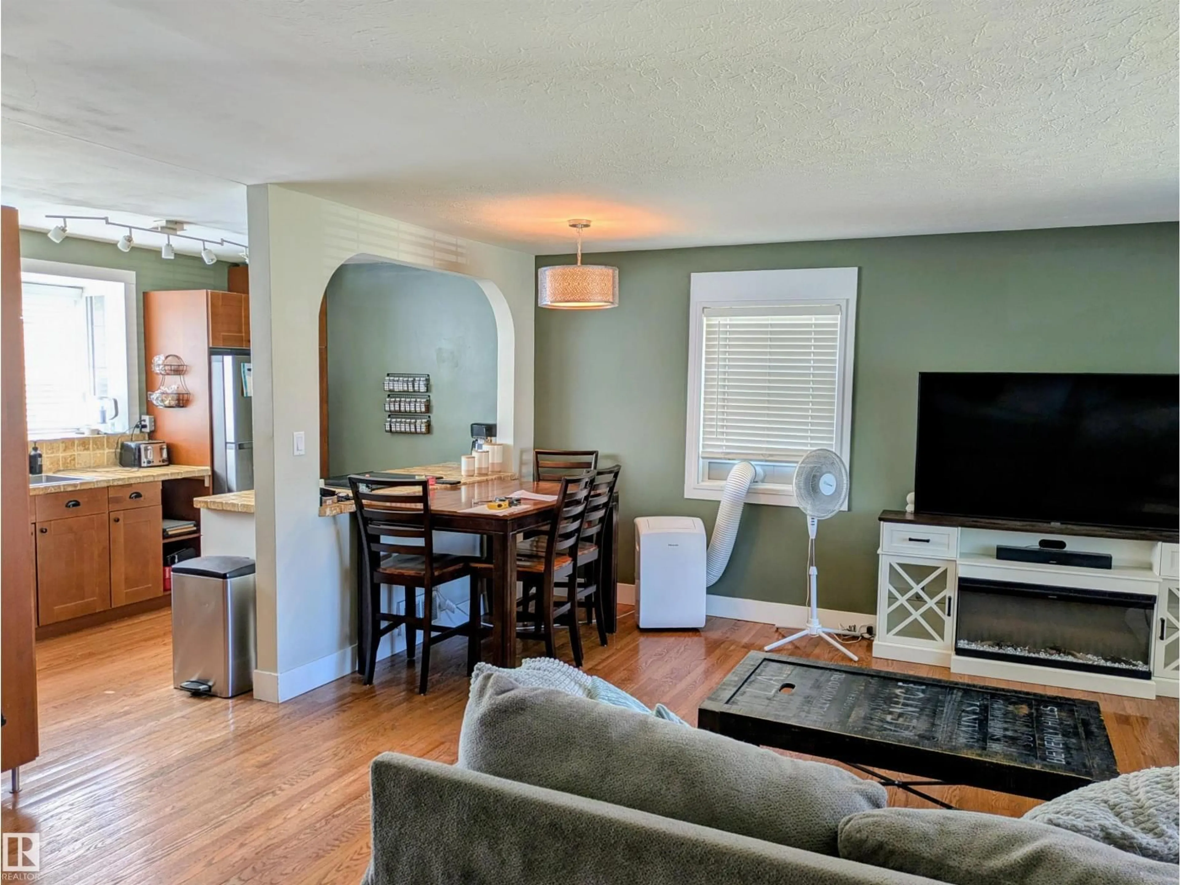 Living room with furniture, wood/laminate floor for 14347 92A AV, Edmonton Alberta T5R5E3
