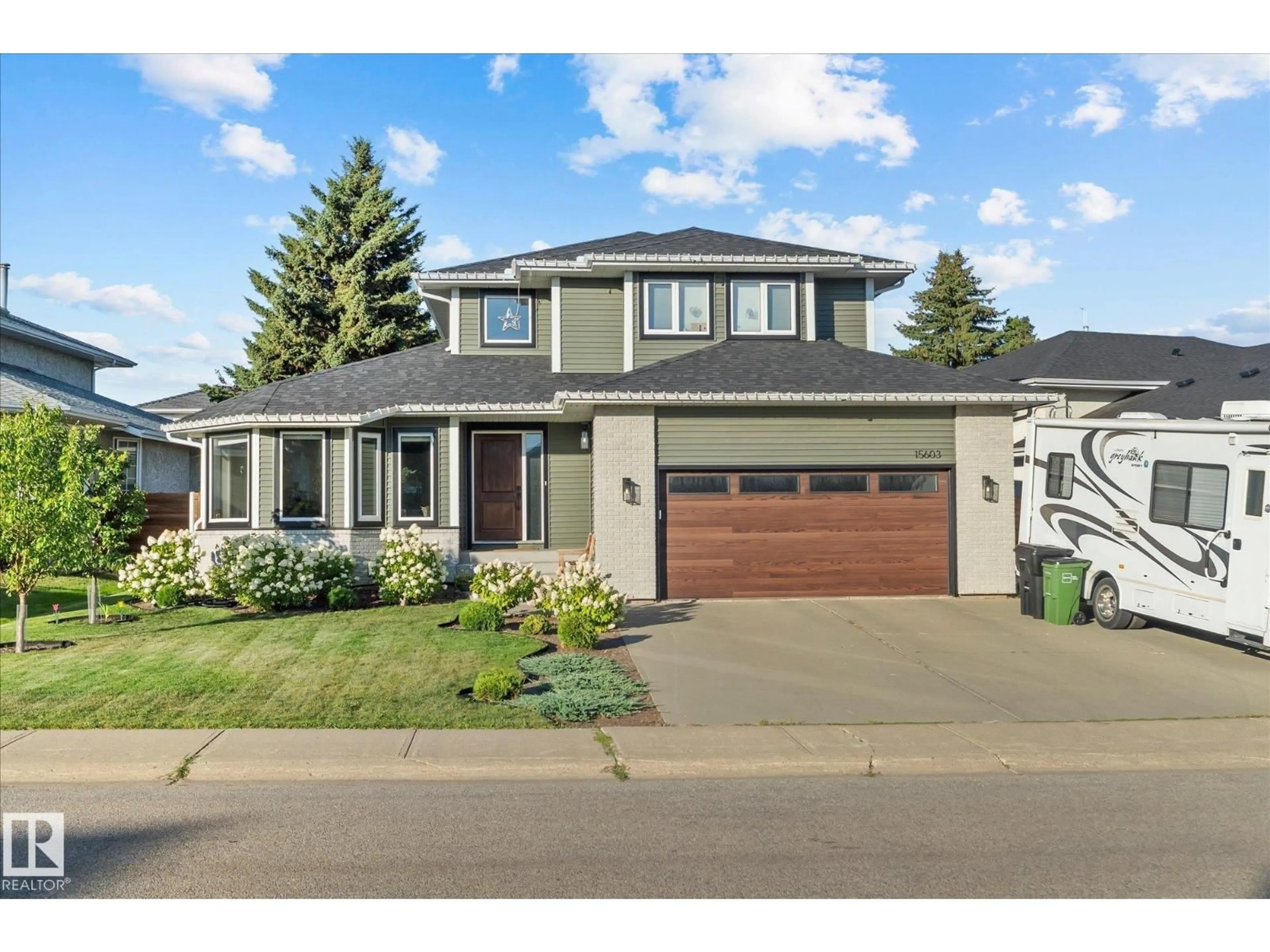 Home with vinyl exterior material, street for NW - 15603 64 ST, Edmonton Alberta T5Y2N4