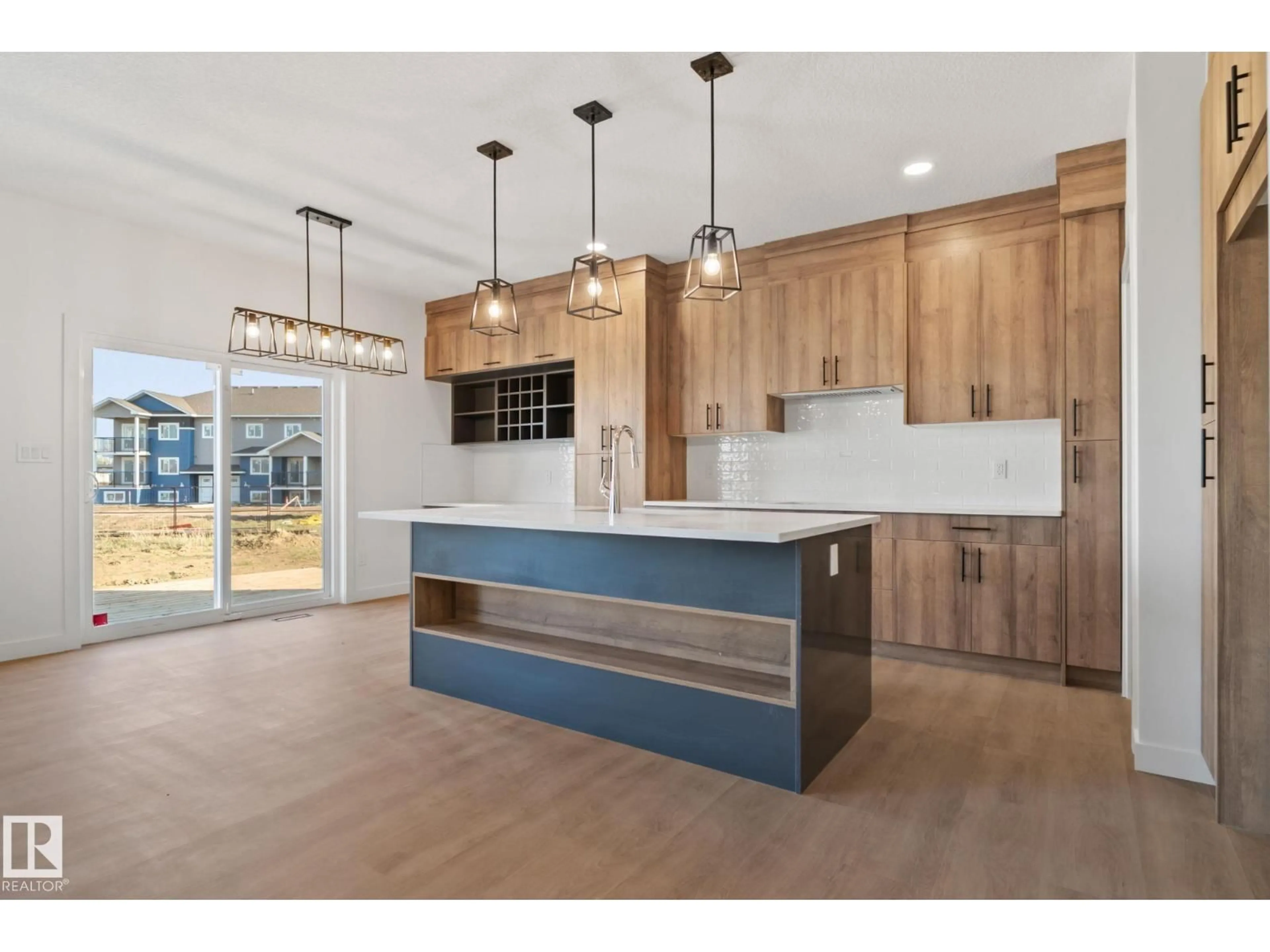 Open concept kitchen, wood/laminate floor for 36 SUN MEADOWS CL, Stony Plain Alberta T7Z0K1