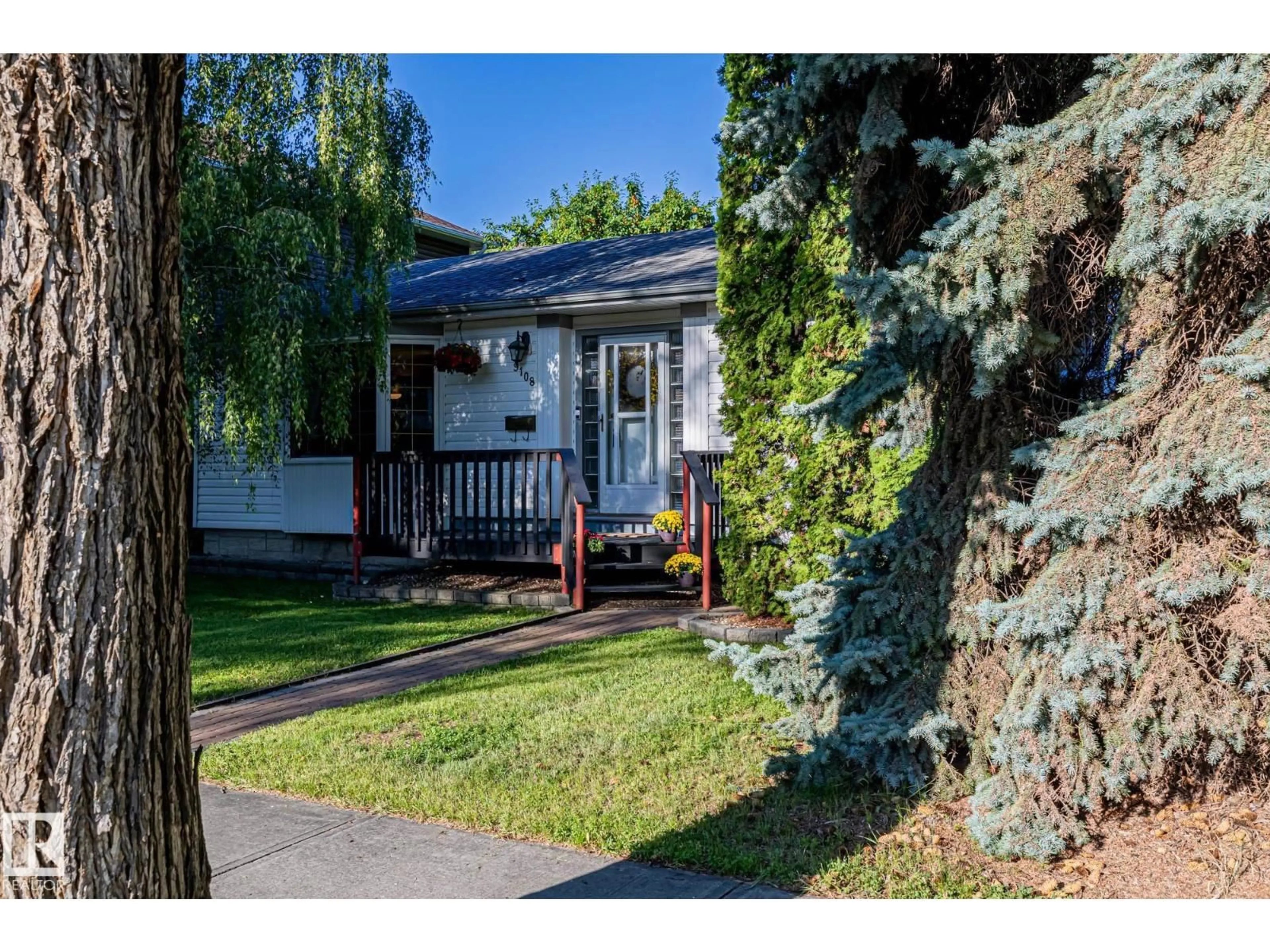 Home with vinyl exterior material, street for 9108 79 ST, Edmonton Alberta T6C2R4