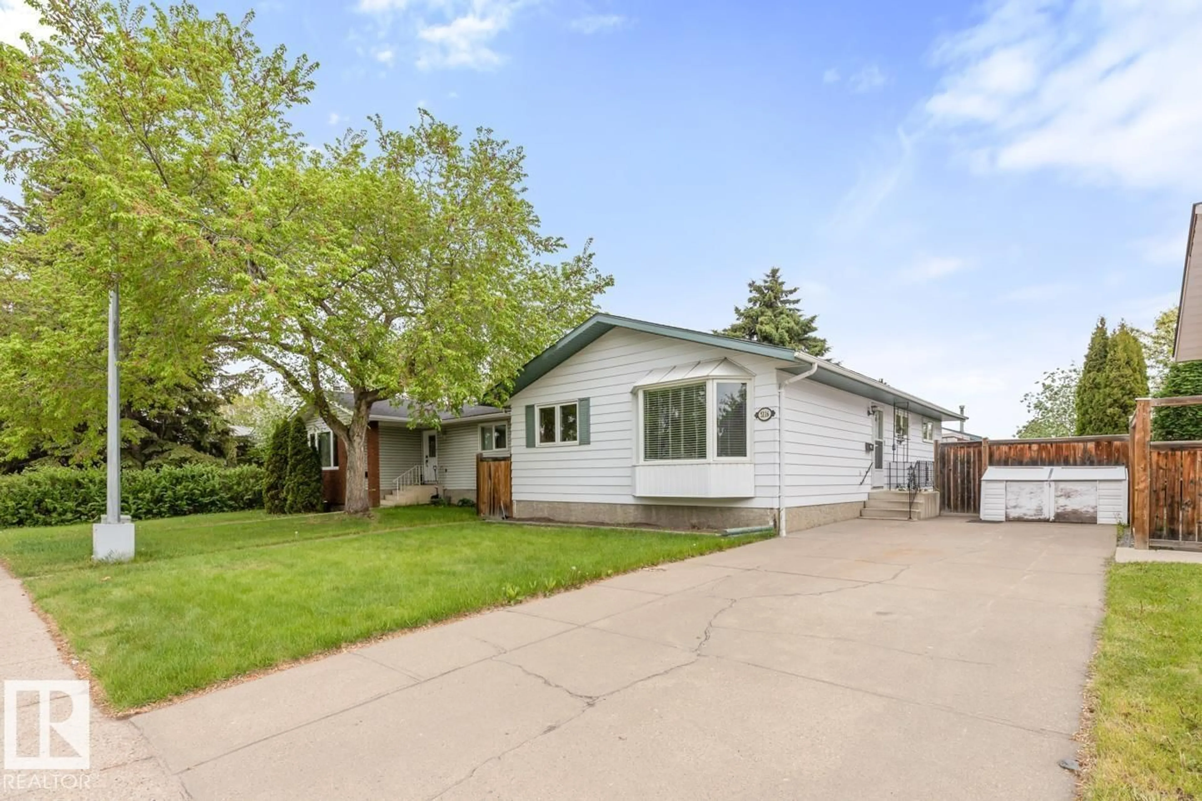 Home with vinyl exterior material, street for 5116 14 AV, Edmonton Alberta T6L1Z8