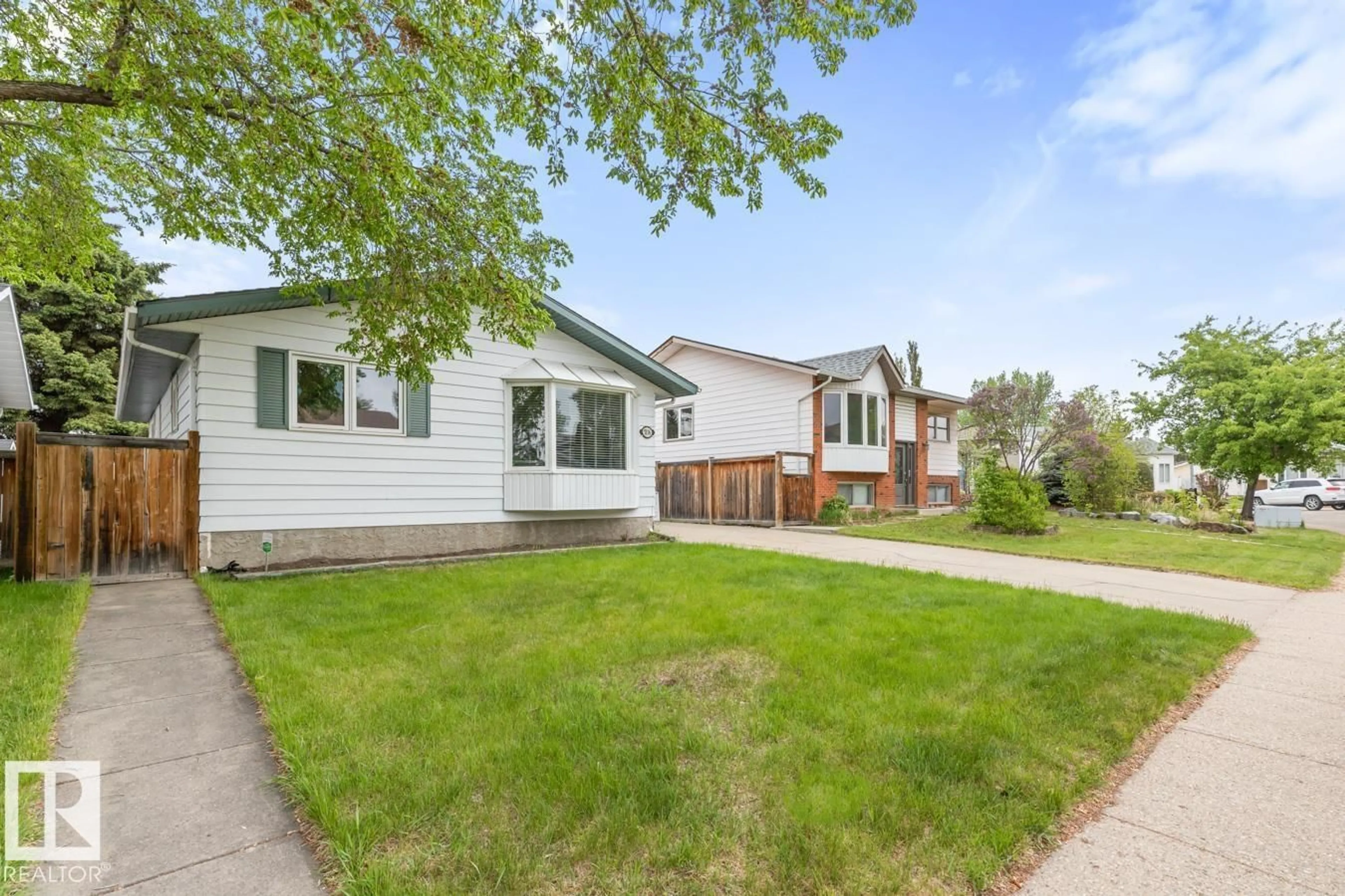 Home with vinyl exterior material, street for 5116 14 AV, Edmonton Alberta T6L1Z8