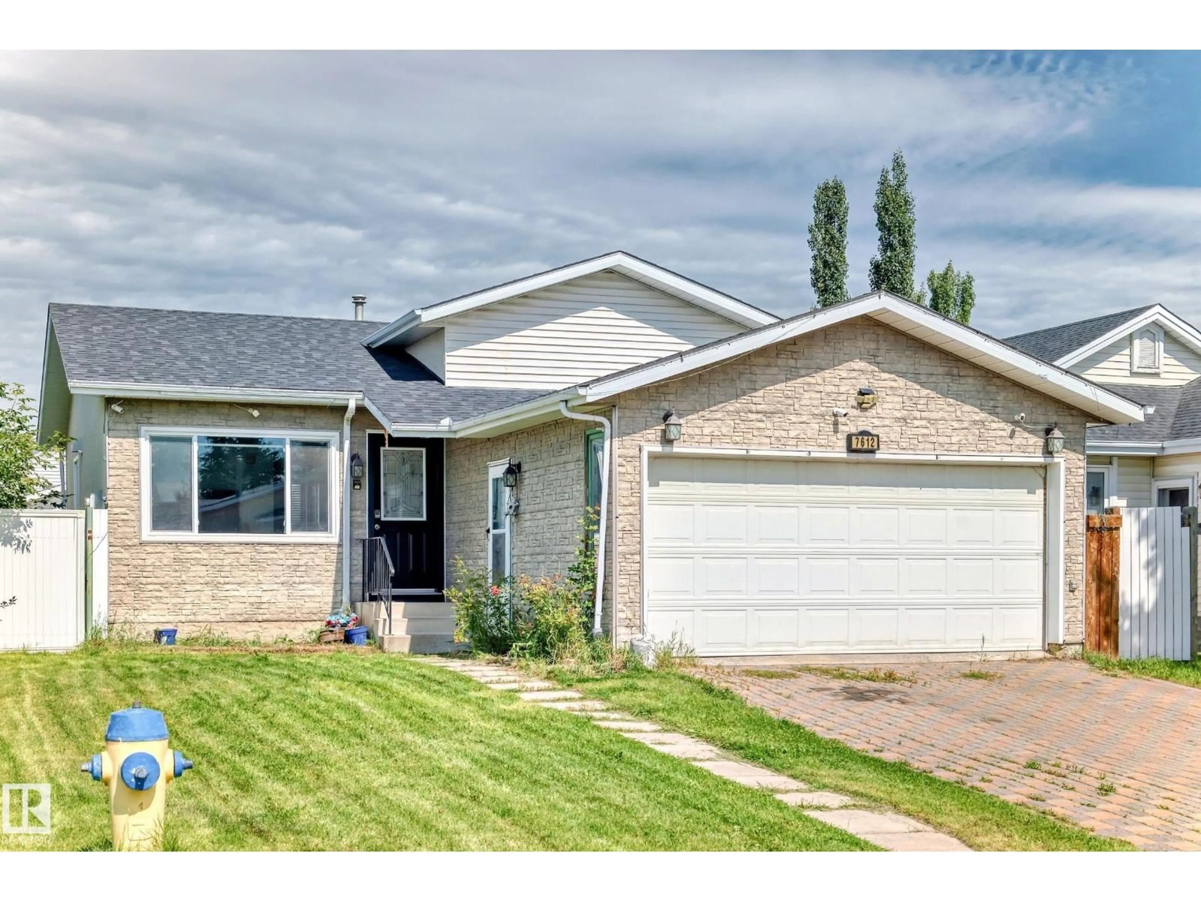 Home with brick exterior material, street for NW - 7612 189 ST, Edmonton Alberta T5T5H9
