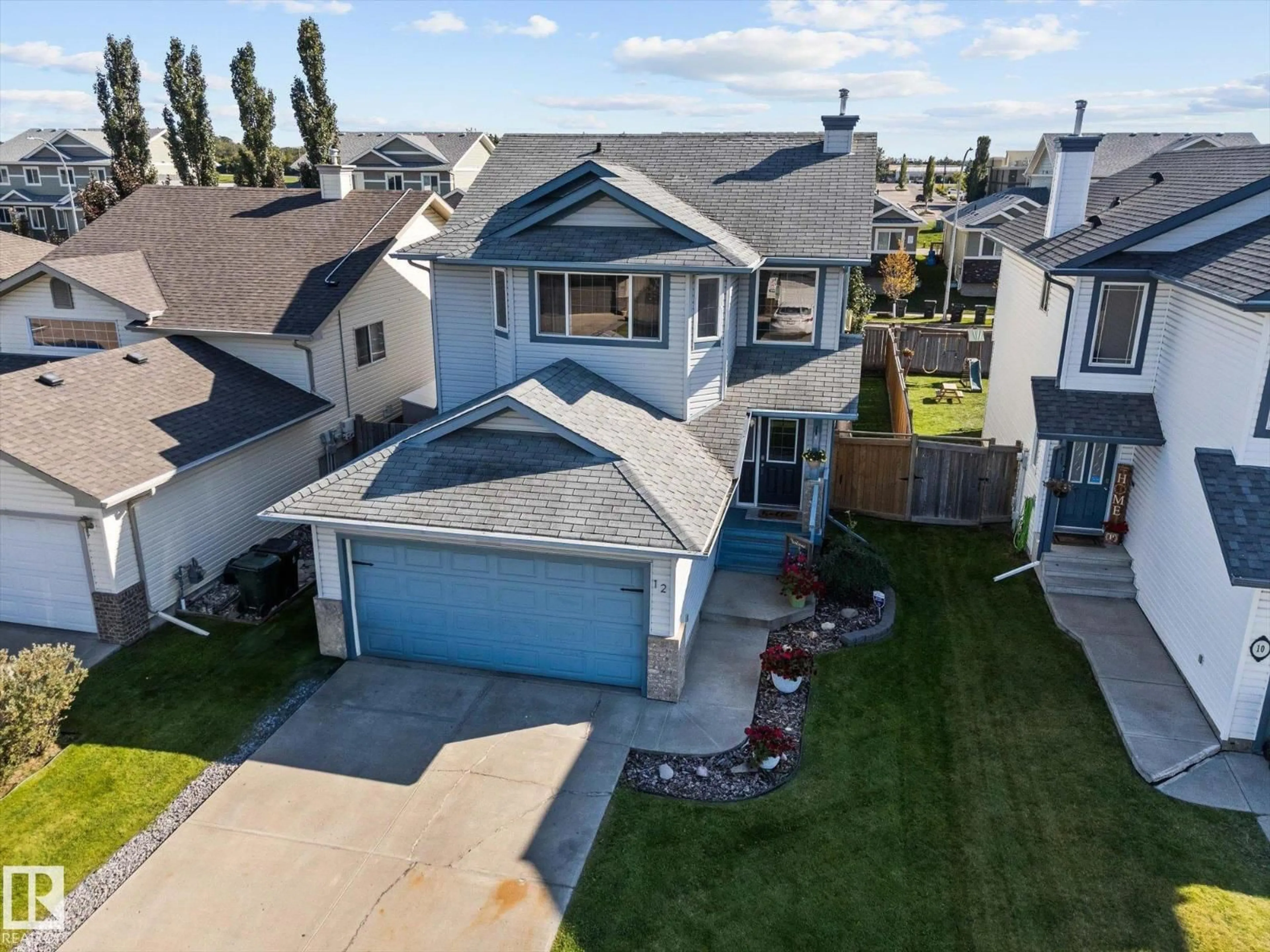 A pic from outside/outdoor area/front of a property/back of a property/a pic from drone, street for 12 LEYLAND WY, Spruce Grove Alberta T7X0A8