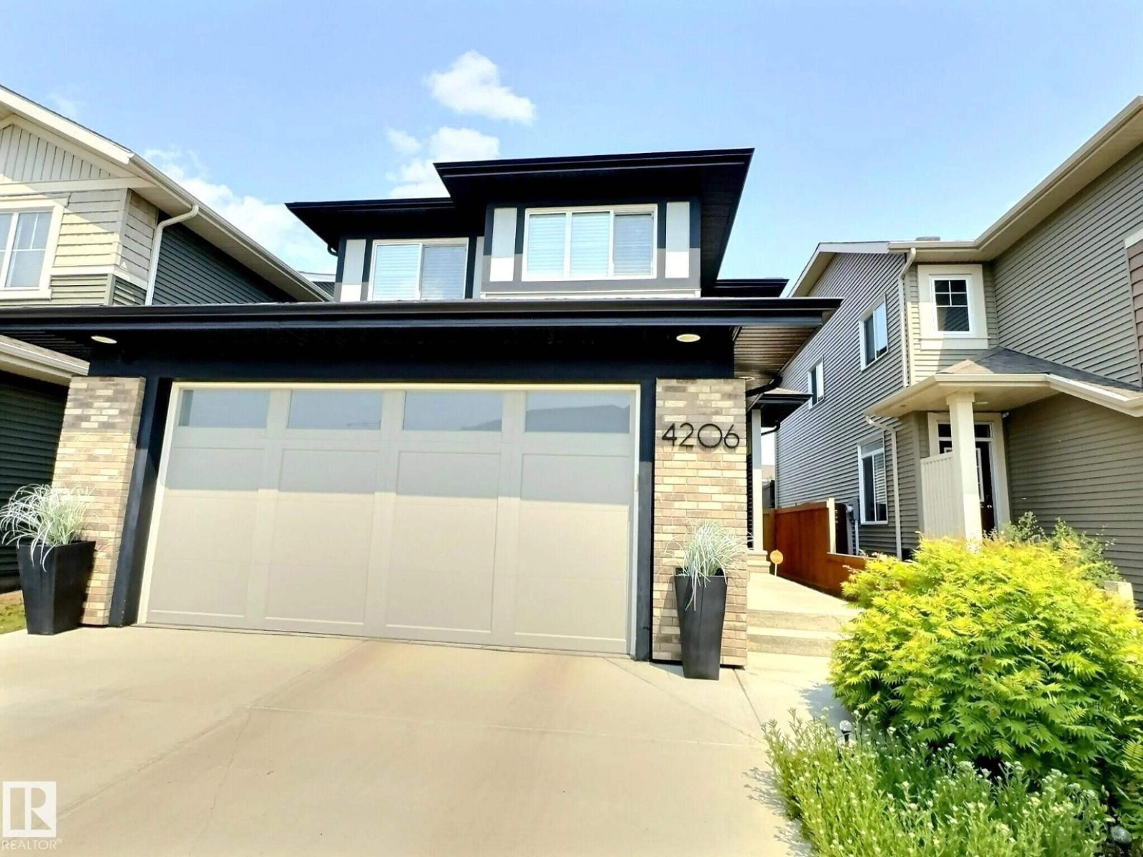 Home with vinyl exterior material, street for 4206 CHICHAK CL, Edmonton Alberta T6W4B3