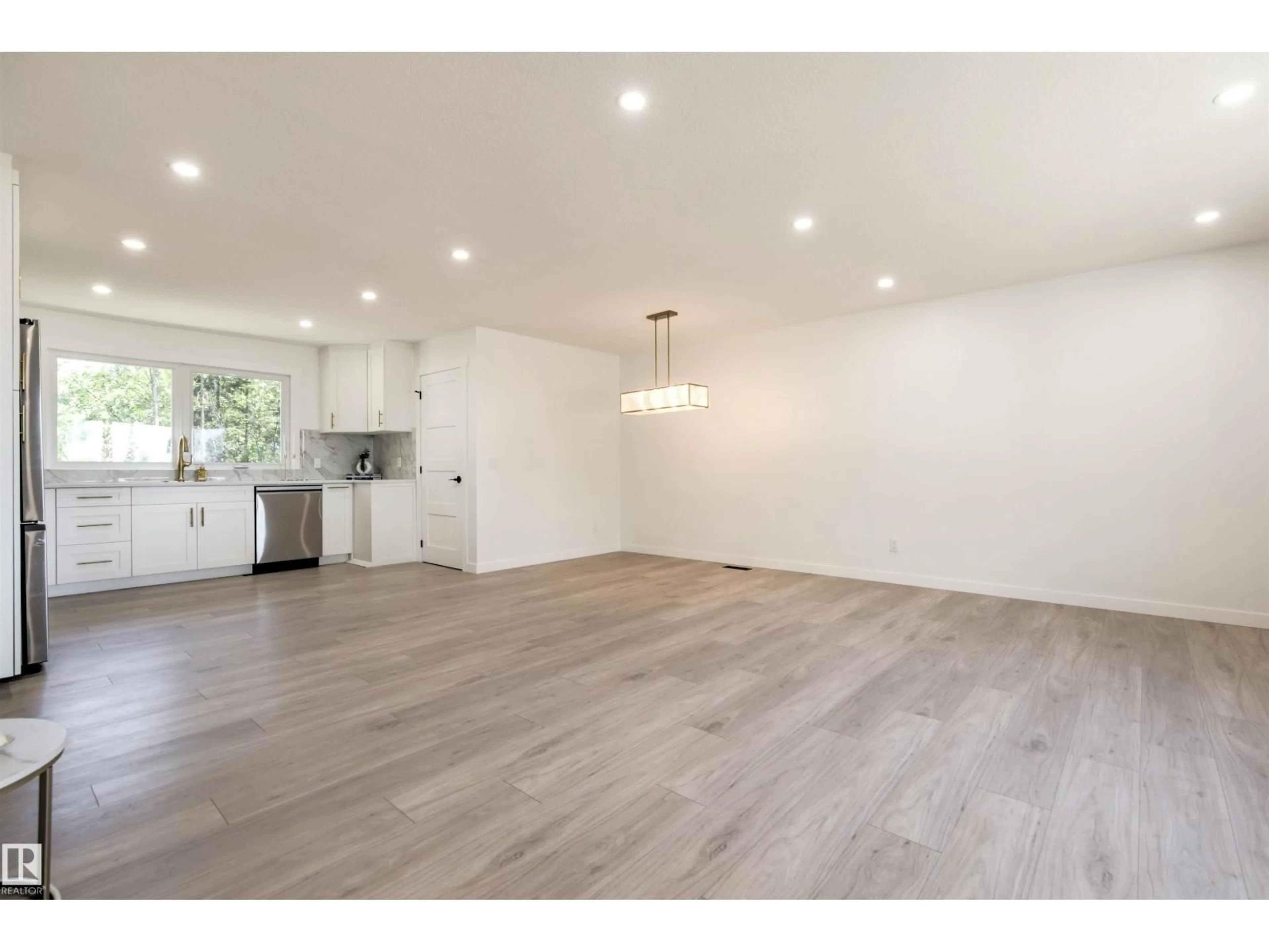 Open concept kitchen, wood/laminate floor for 19 GRENFELL AV, St. Albert Alberta T8N0Y9