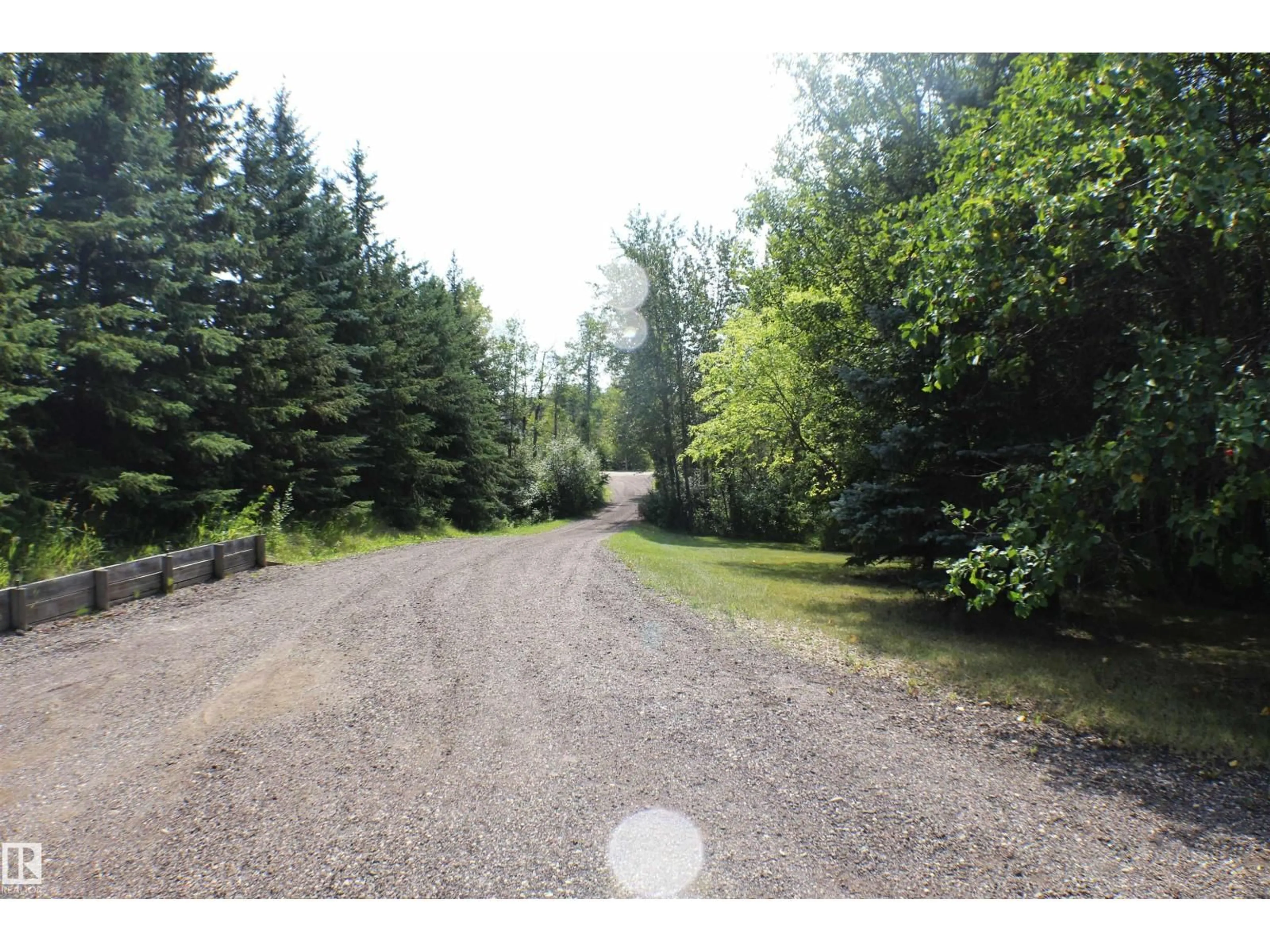 A pic from outside/outdoor area/front of a property/back of a property/a pic from drone, forest/trees view for 14 - 52152 RGE ROAD 210, Rural Strathcona County Alberta T8G1A5