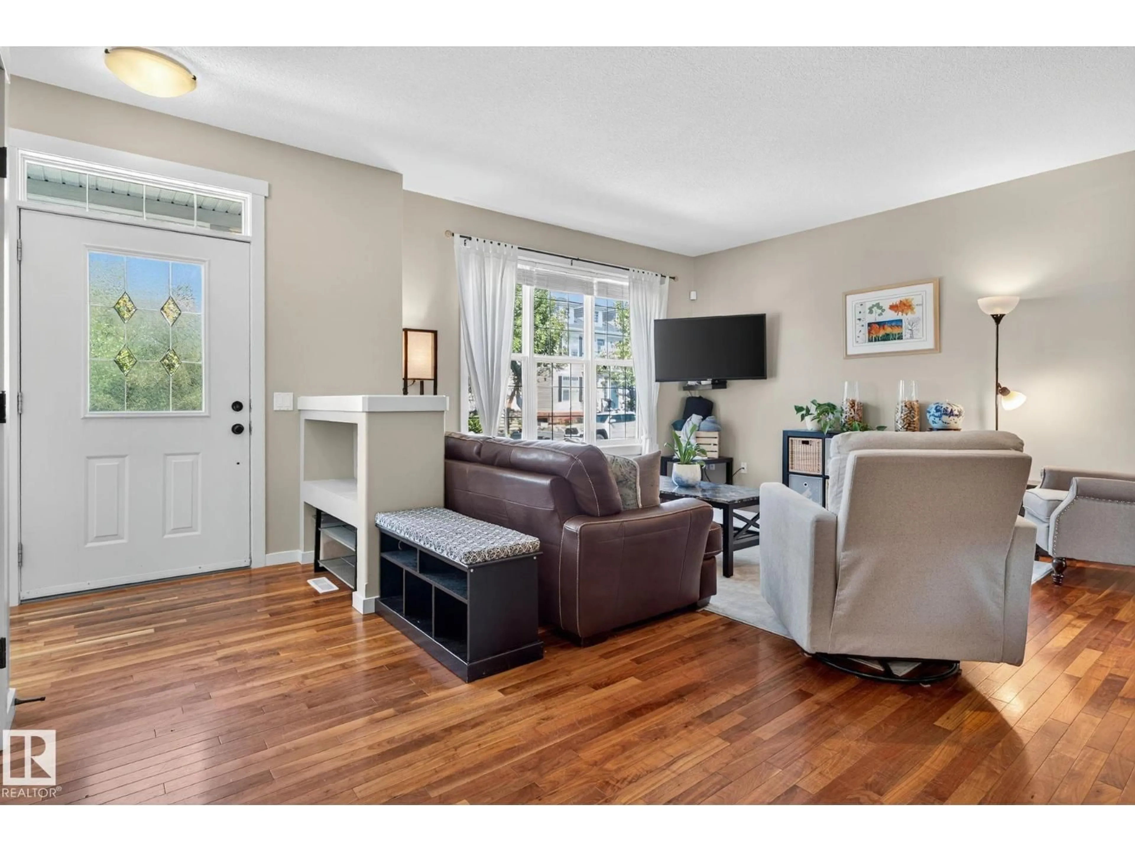 Living room with furniture, wood/laminate floor for 1210 COLONEL STONE AV, Edmonton Alberta T5E0E5