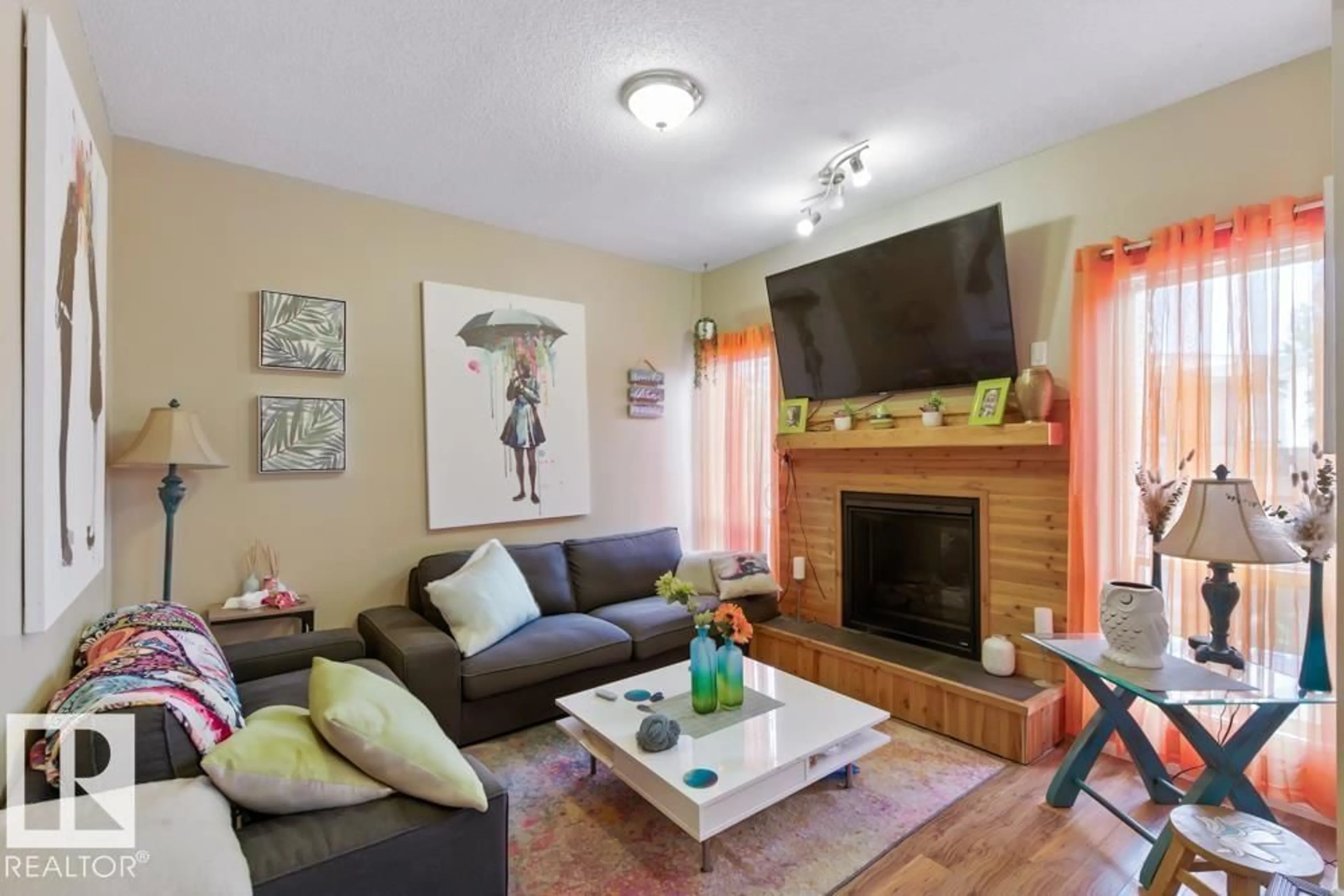 Living room with furniture, wood/laminate floor for #54 - 3812 20 AV, Edmonton Alberta T6L4B2