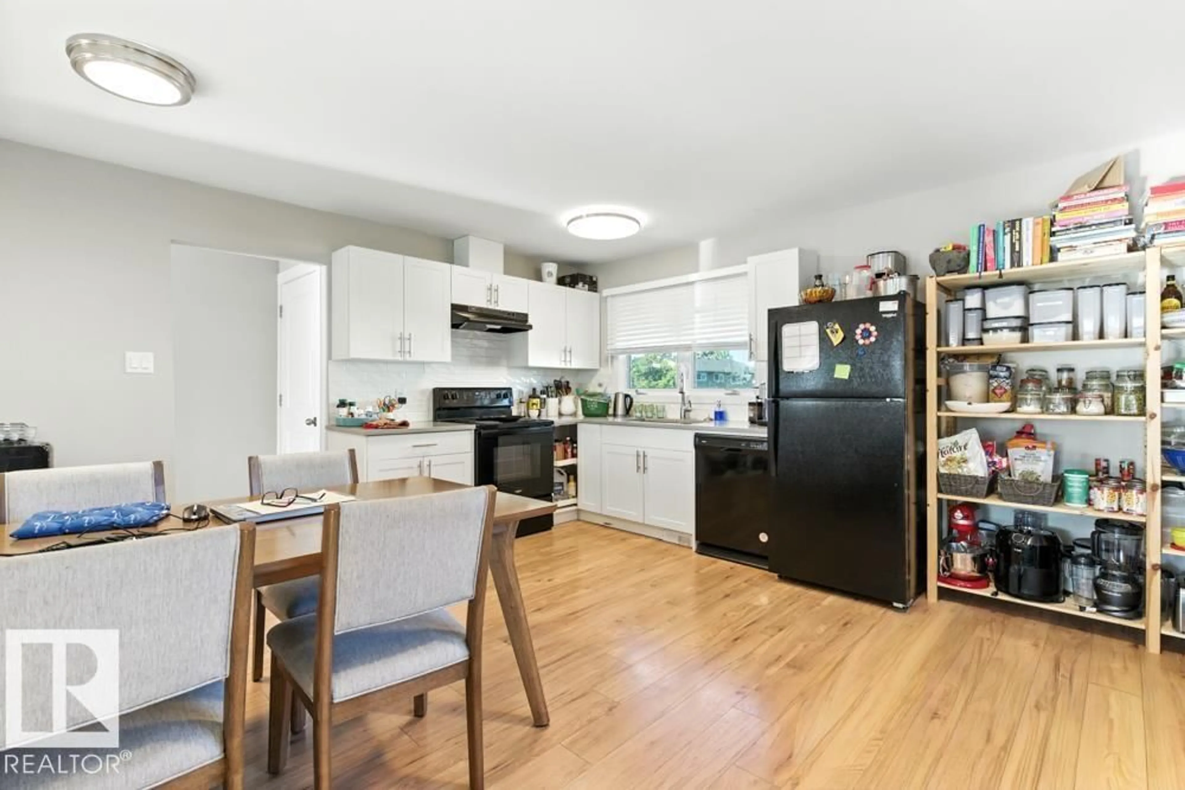 Open concept kitchen, wood/laminate floor for 15012 74 ST, Edmonton Alberta T5C0Y7
