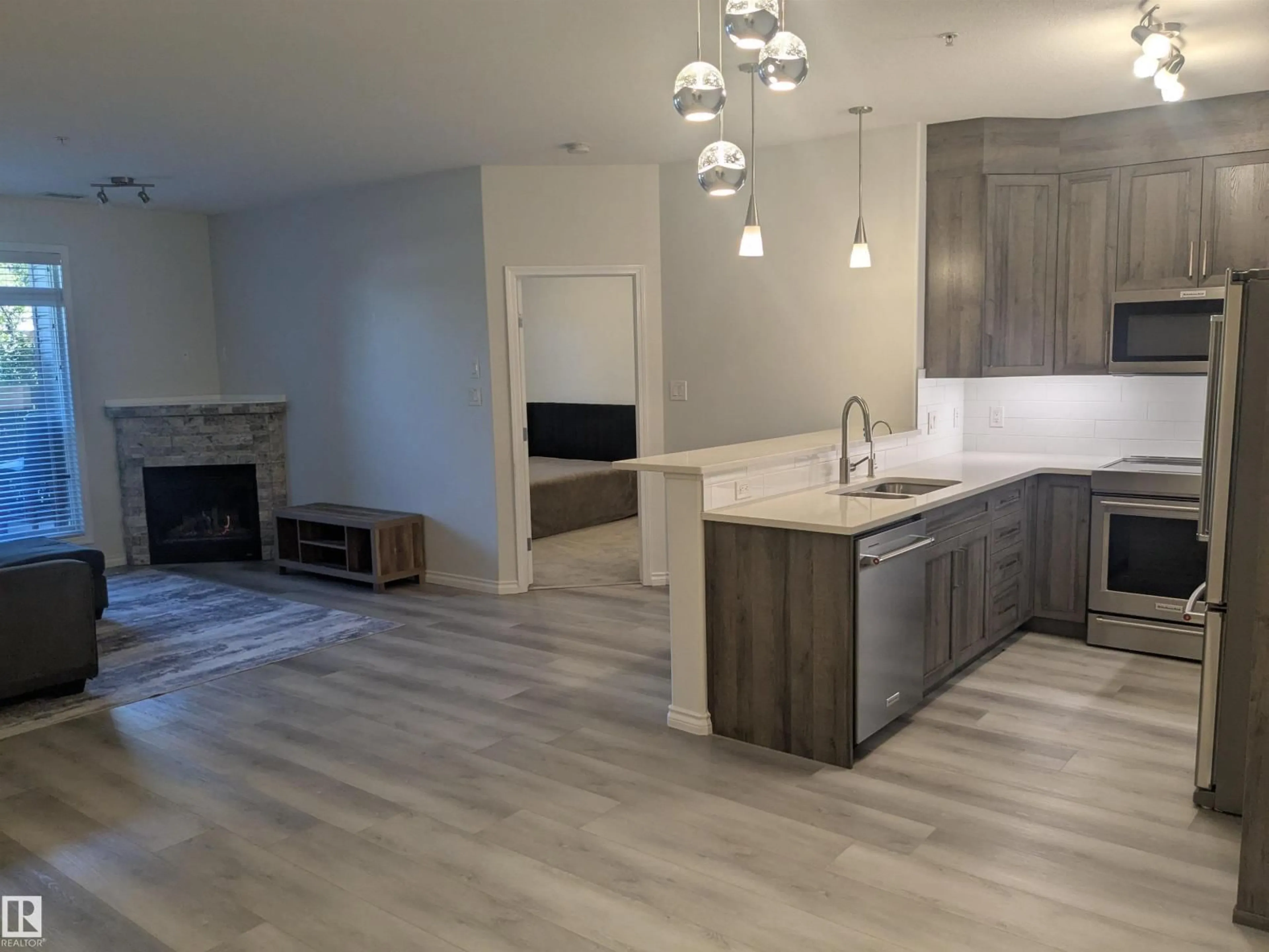 Open concept kitchen, unknown for #118 - 2503 HANNA CR, Edmonton Alberta T6R0H1